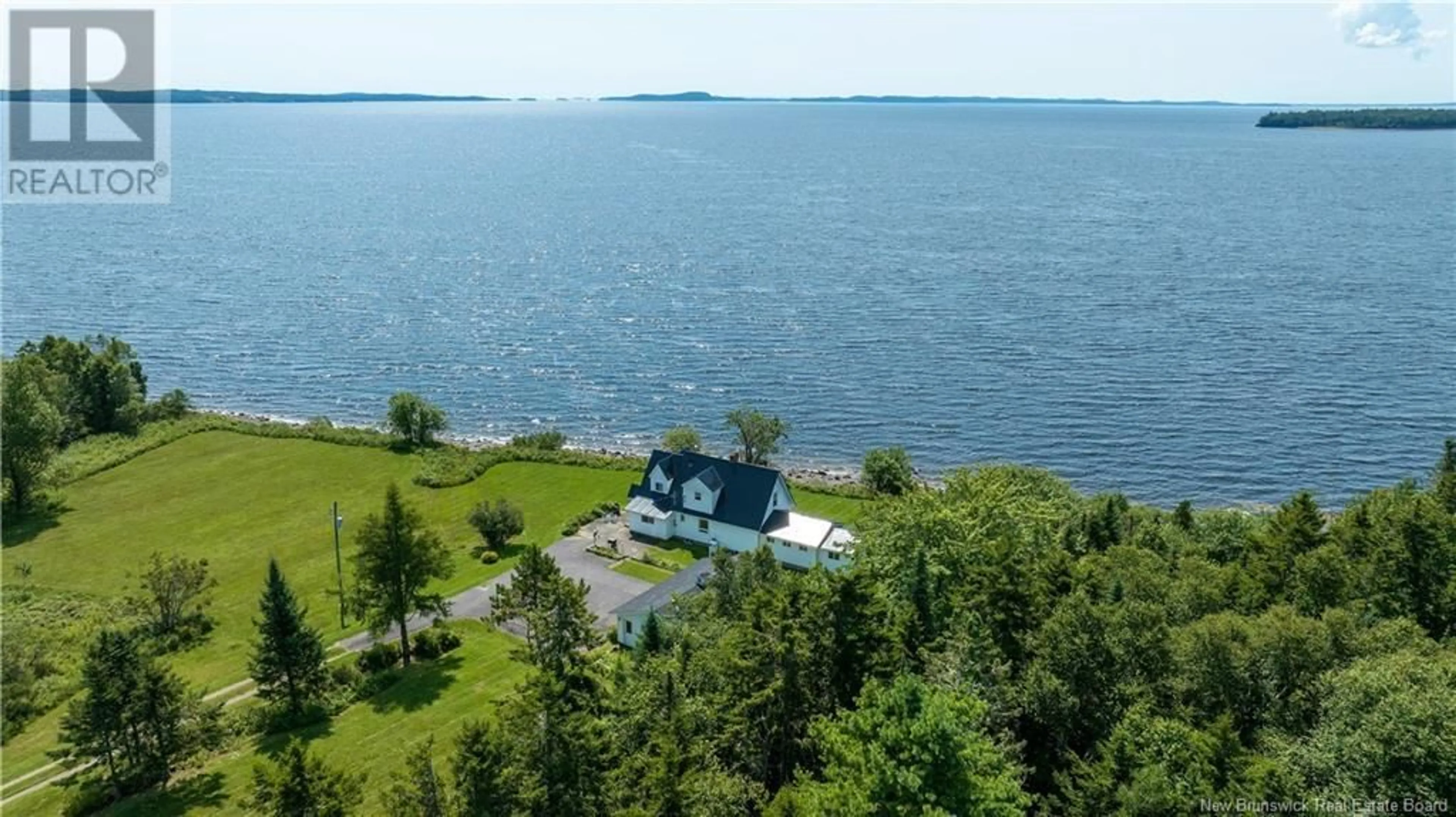 A pic from outside/outdoor area/front of a property/back of a property/a pic from drone, water/lake/river/ocean view for 280 HOLTS POINT ROAD, Bocabec New Brunswick E5B3N4