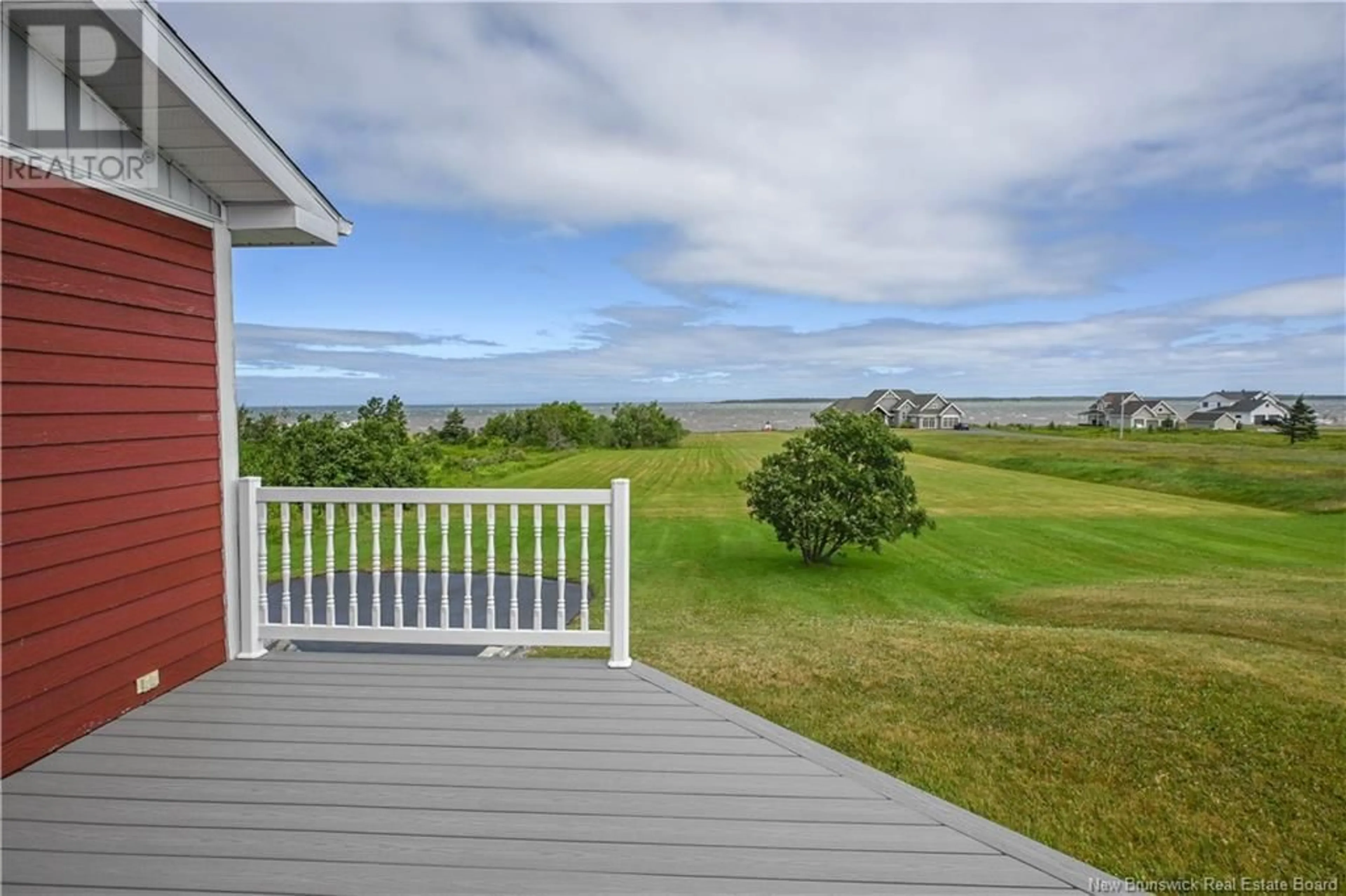 A pic from outside/outdoor area/front of a property/back of a property/a pic from drone, water/lake/river/ocean view for 301 RUE DE L'ILE, Caraquet New Brunswick E1W1B5