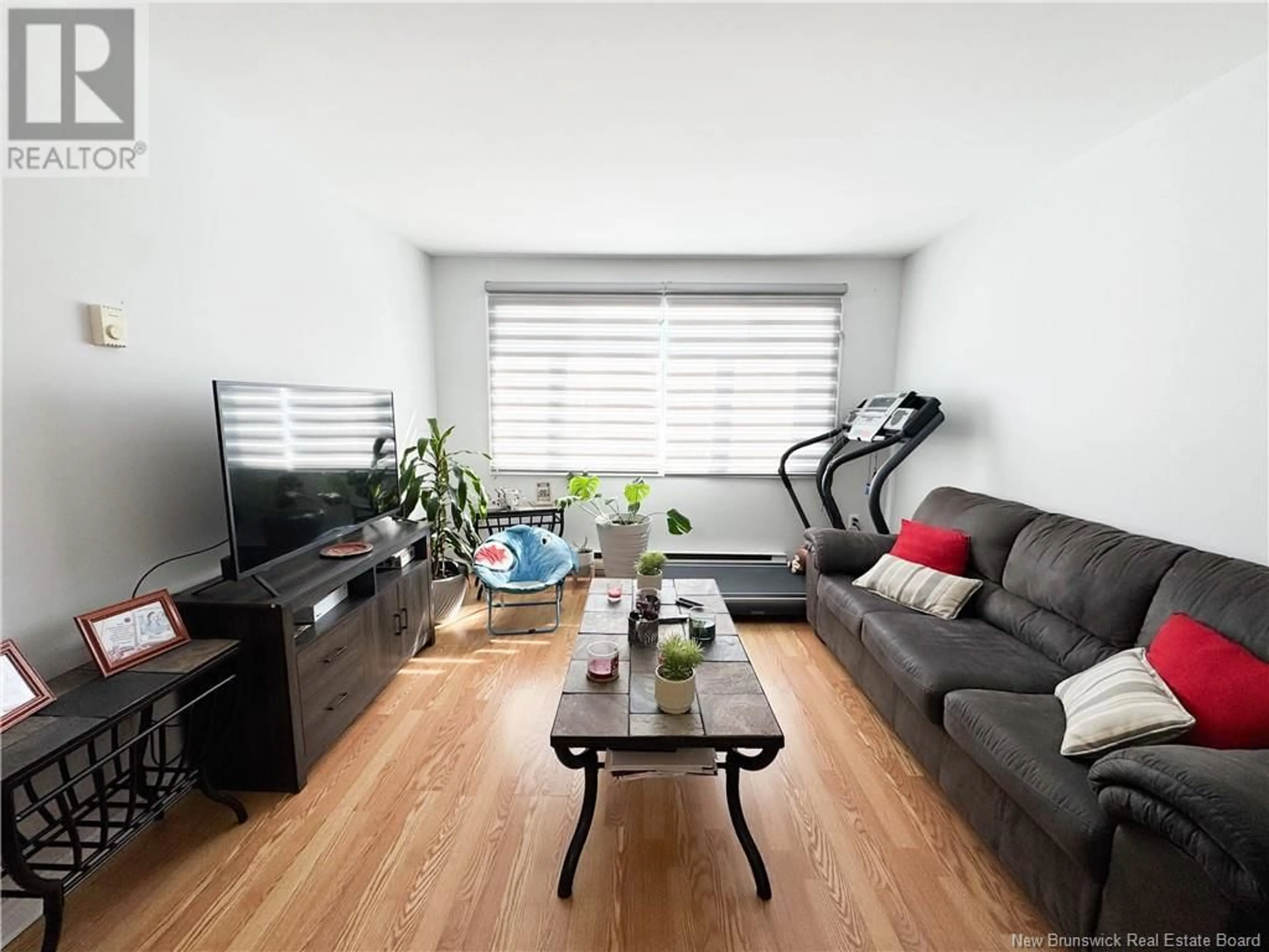 Living room with furniture, wood/laminate floor for 11 - 125 COLDBROOK CRESCENT, Saint John New Brunswick E2J3Z3