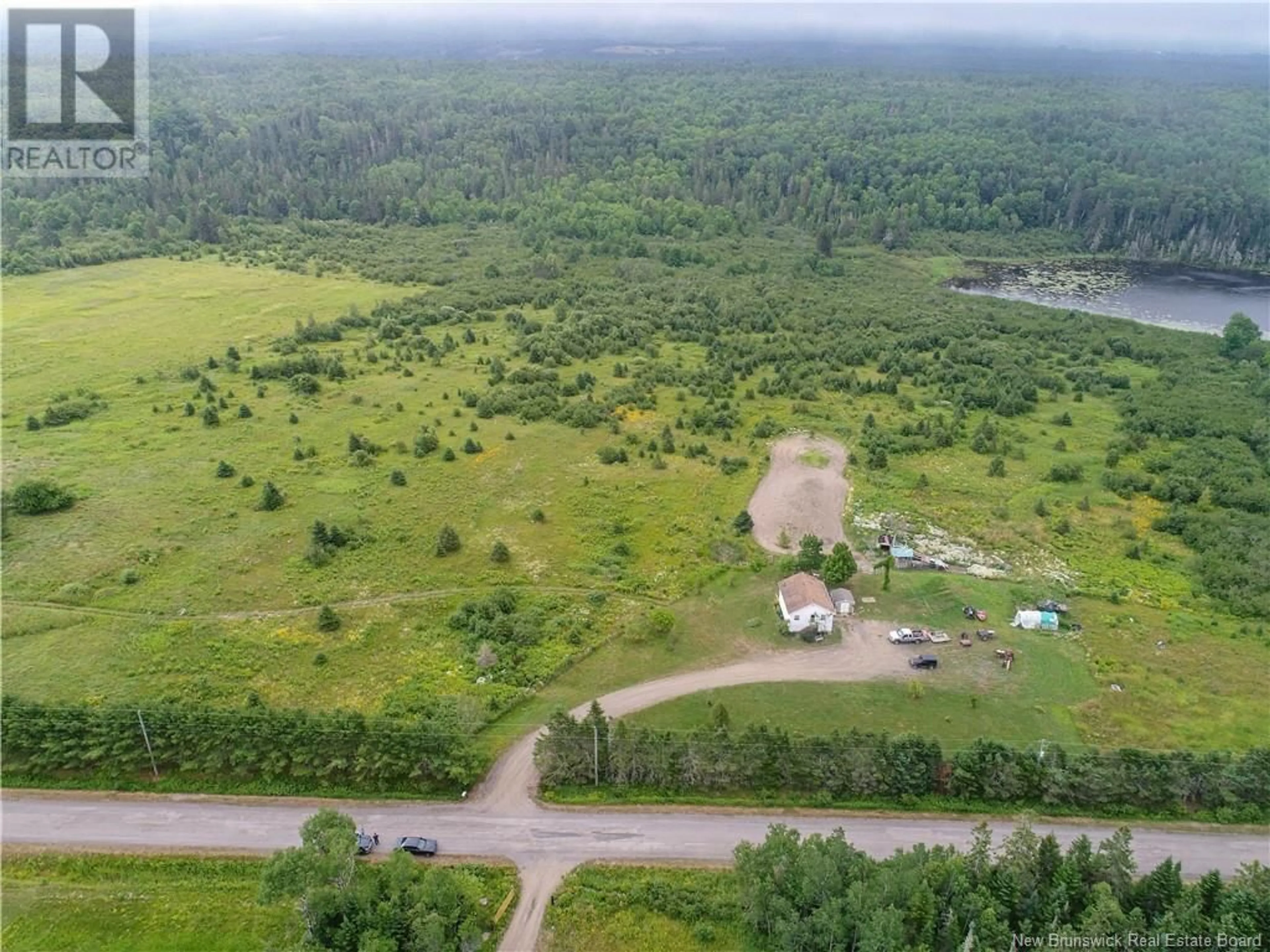 A pic from outside/outdoor area/front of a property/back of a property/a pic from drone, forest/trees view for 40 DEVINE RD, Erb Settlement New Brunswick E5P3E8