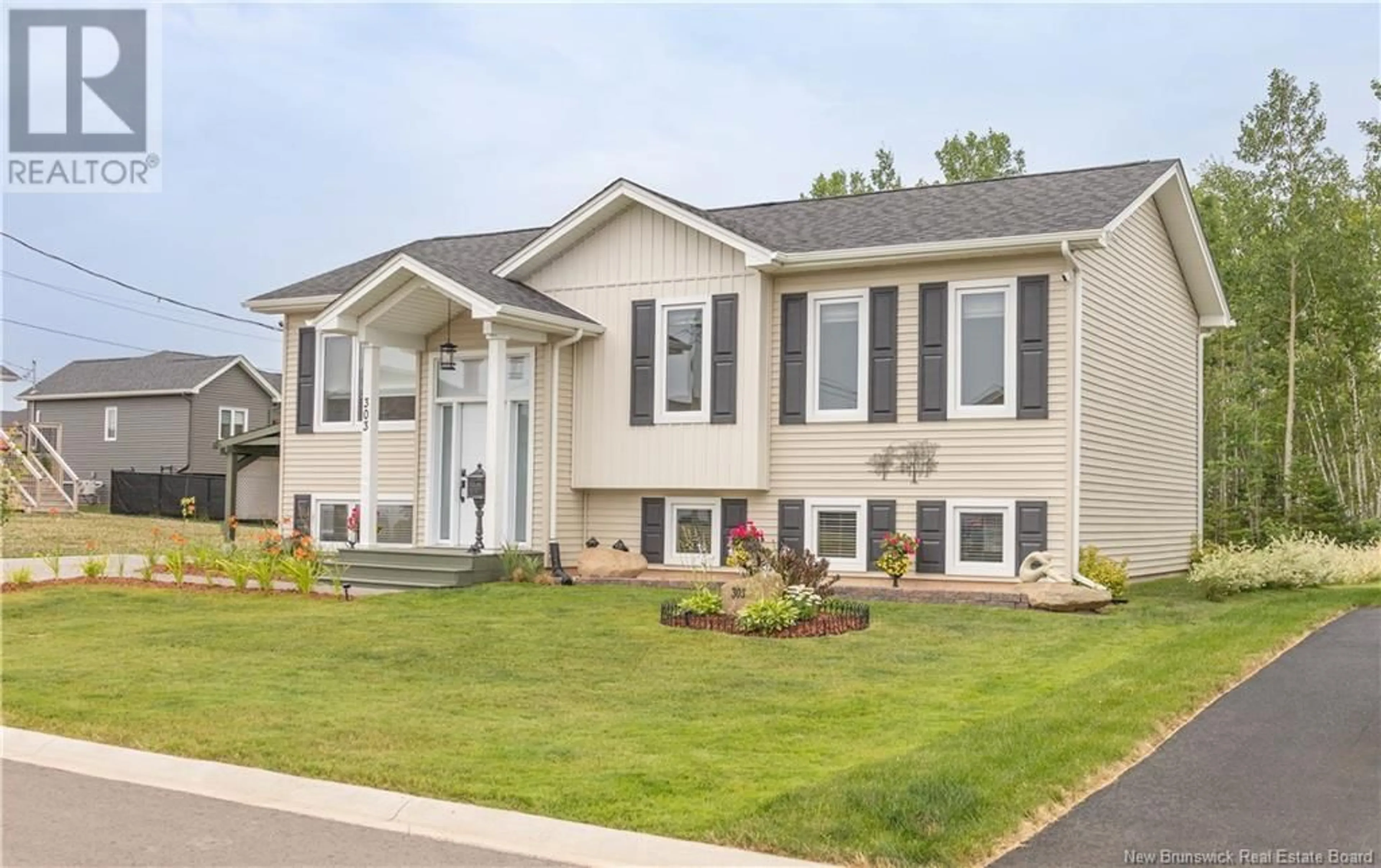 Home with vinyl exterior material, street for 303 CHATELLERAULT, Shediac New Brunswick E4P0L3