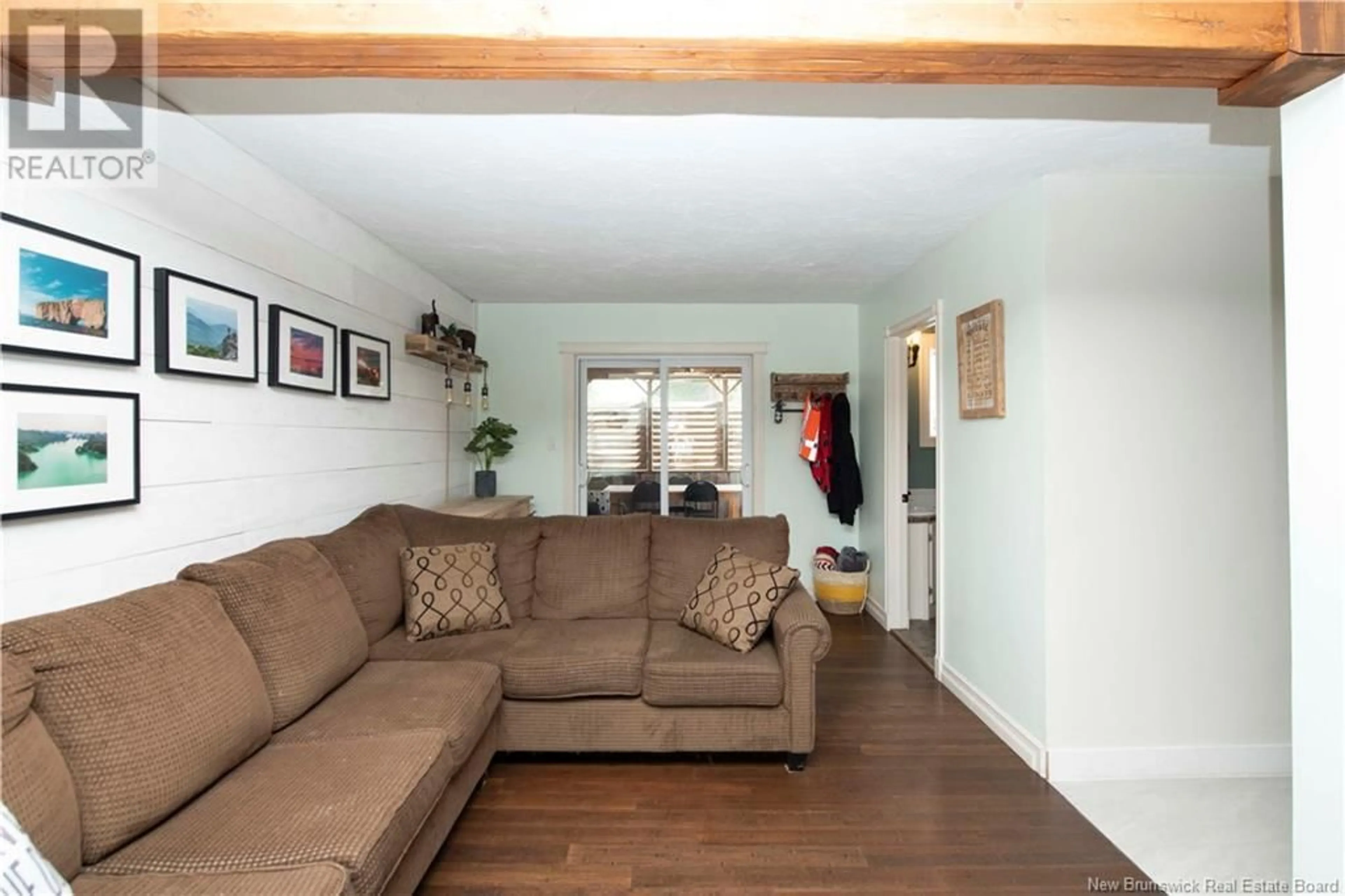 Living room with furniture, wood/laminate floor for 49 STOREY ROAD, Moncton New Brunswick E1A2W6