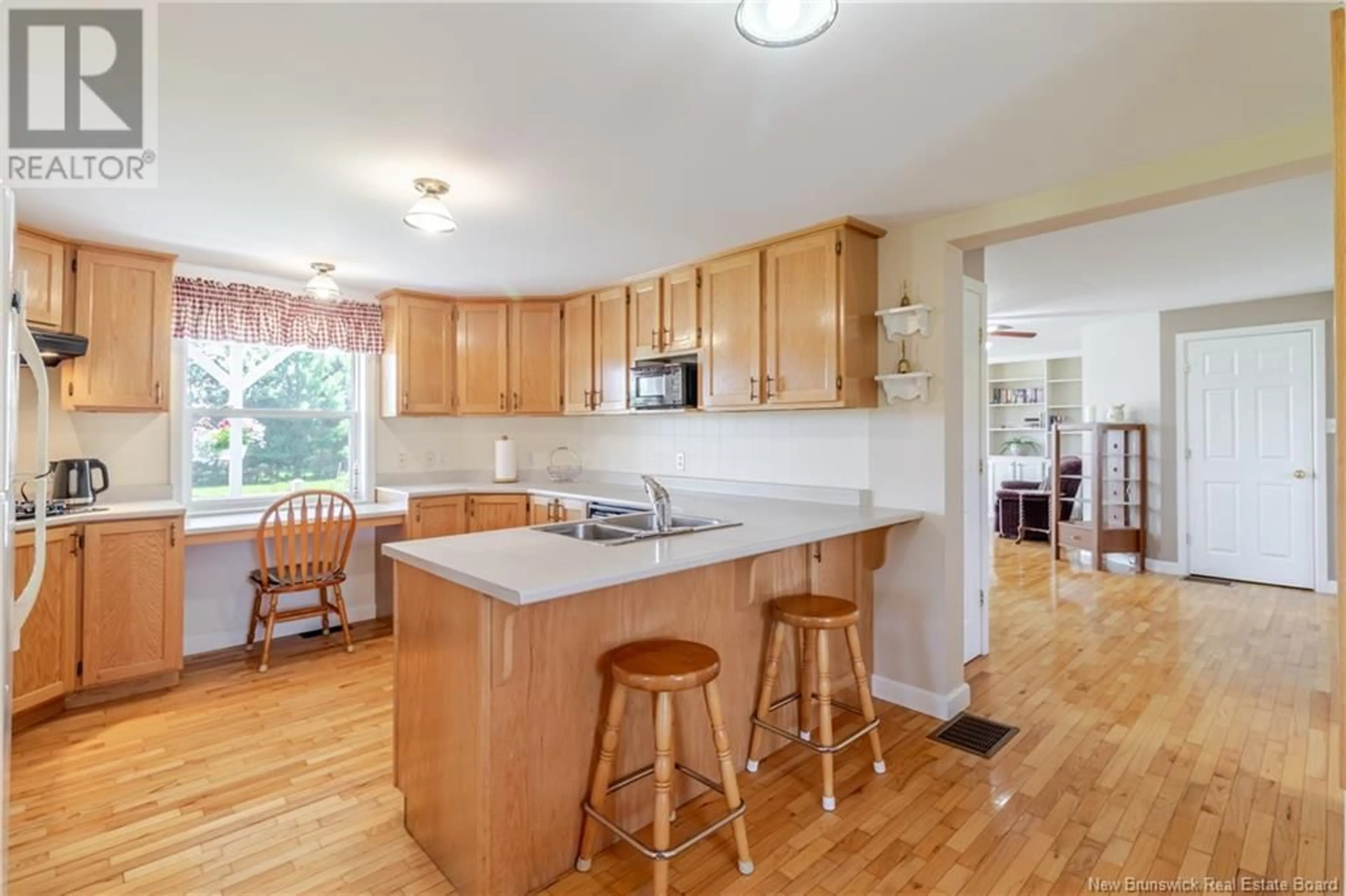 Open concept kitchen, wood/laminate floor for 887 ROUTE 690, Fredericton New Brunswick E4B1P4