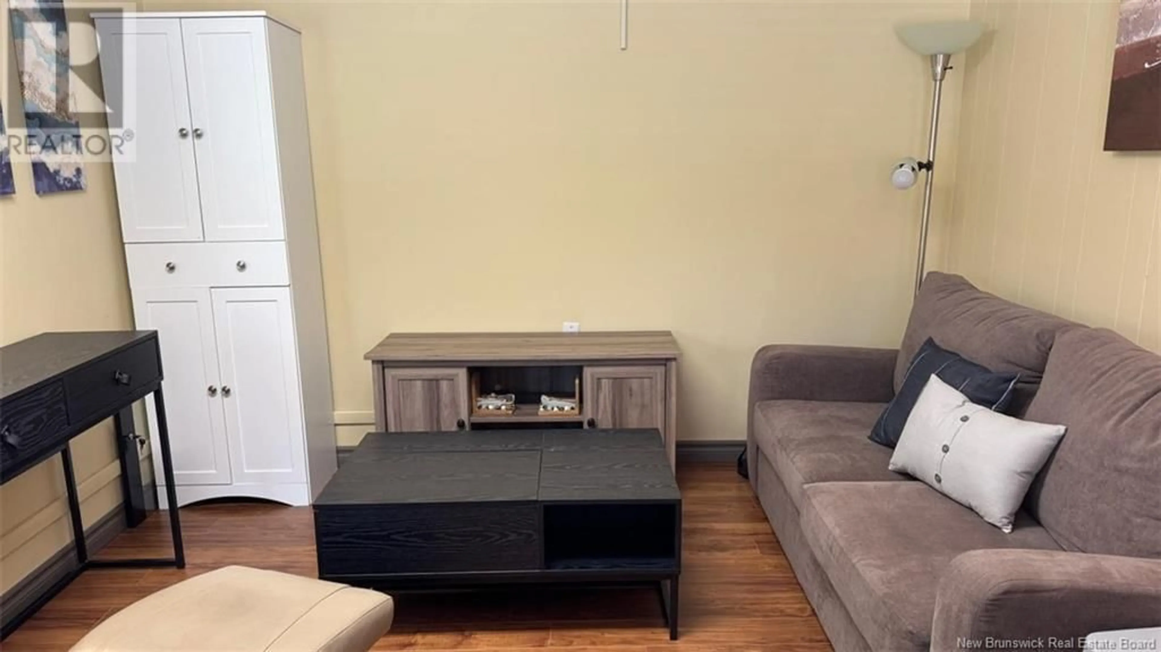Living room with furniture, wood/laminate floor for 74 FRONTIERE STREET, Saint-François-de-Madawaska New Brunswick E7A1C7