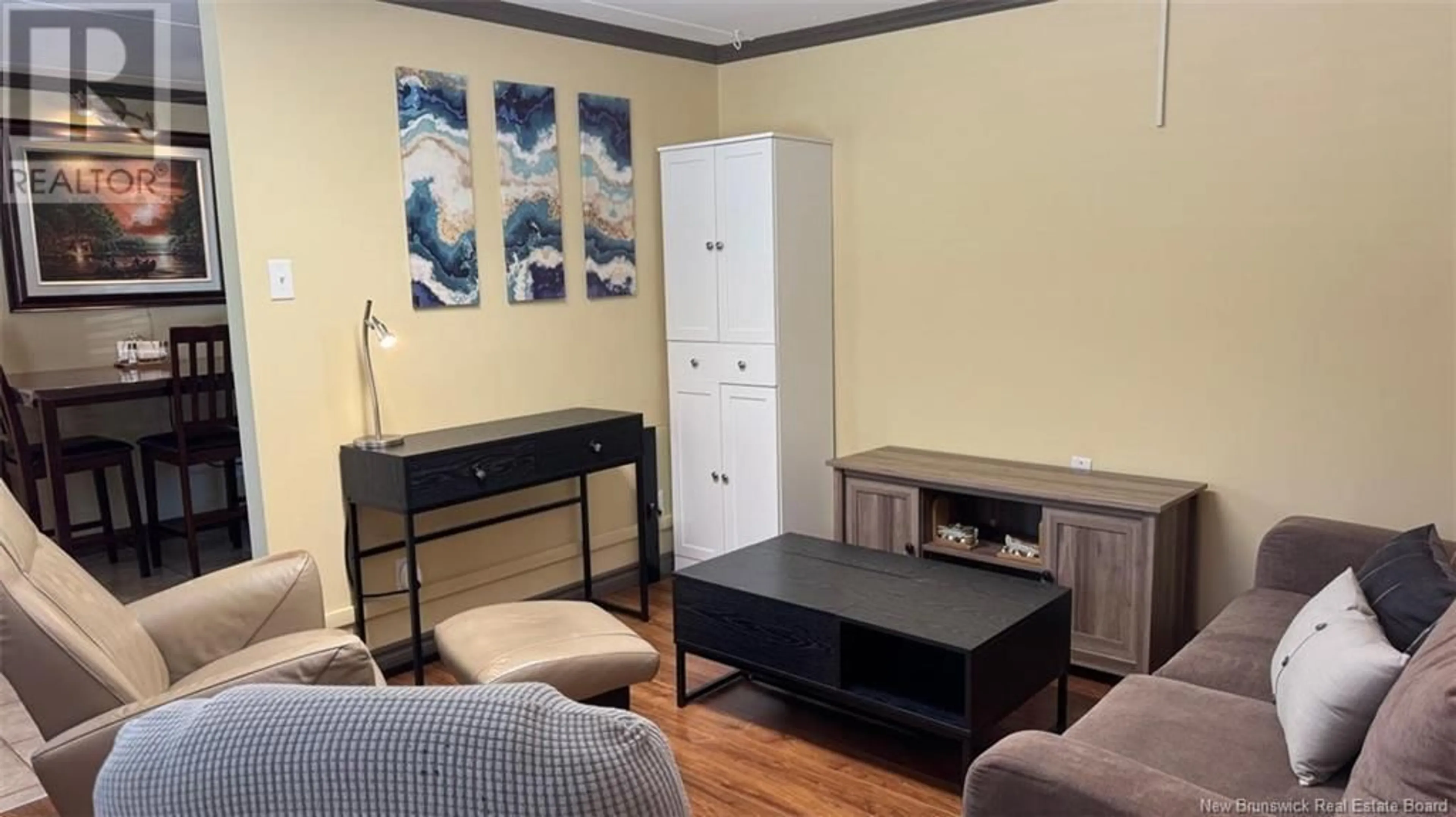 Living room with furniture, wood/laminate floor for 74 FRONTIERE STREET, Saint-François-de-Madawaska New Brunswick E7A1C7