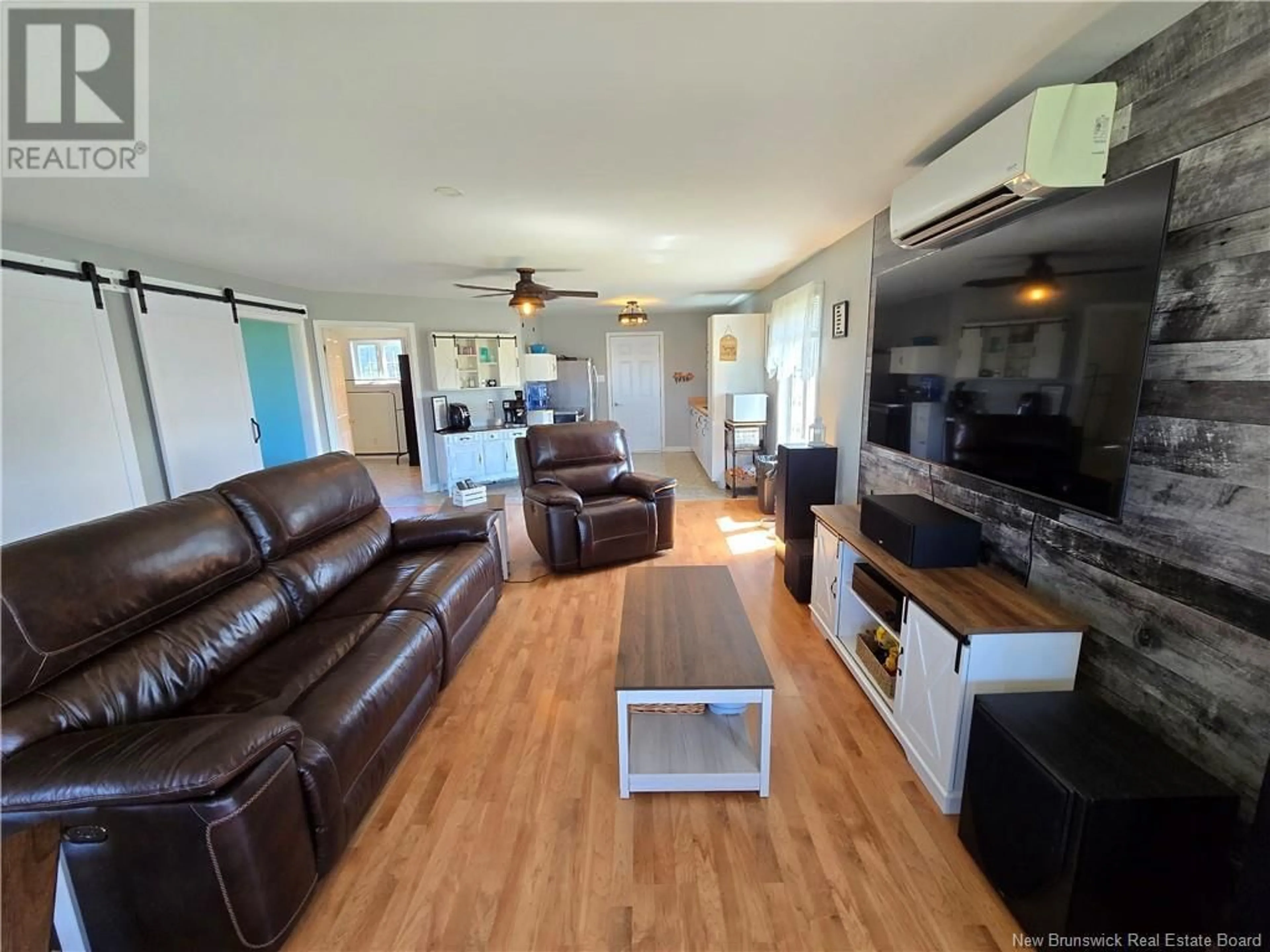Living room with furniture, wood/laminate floor for 49 OCEAN WALK DRIVE, Salmon Beach New Brunswick E2A6C7