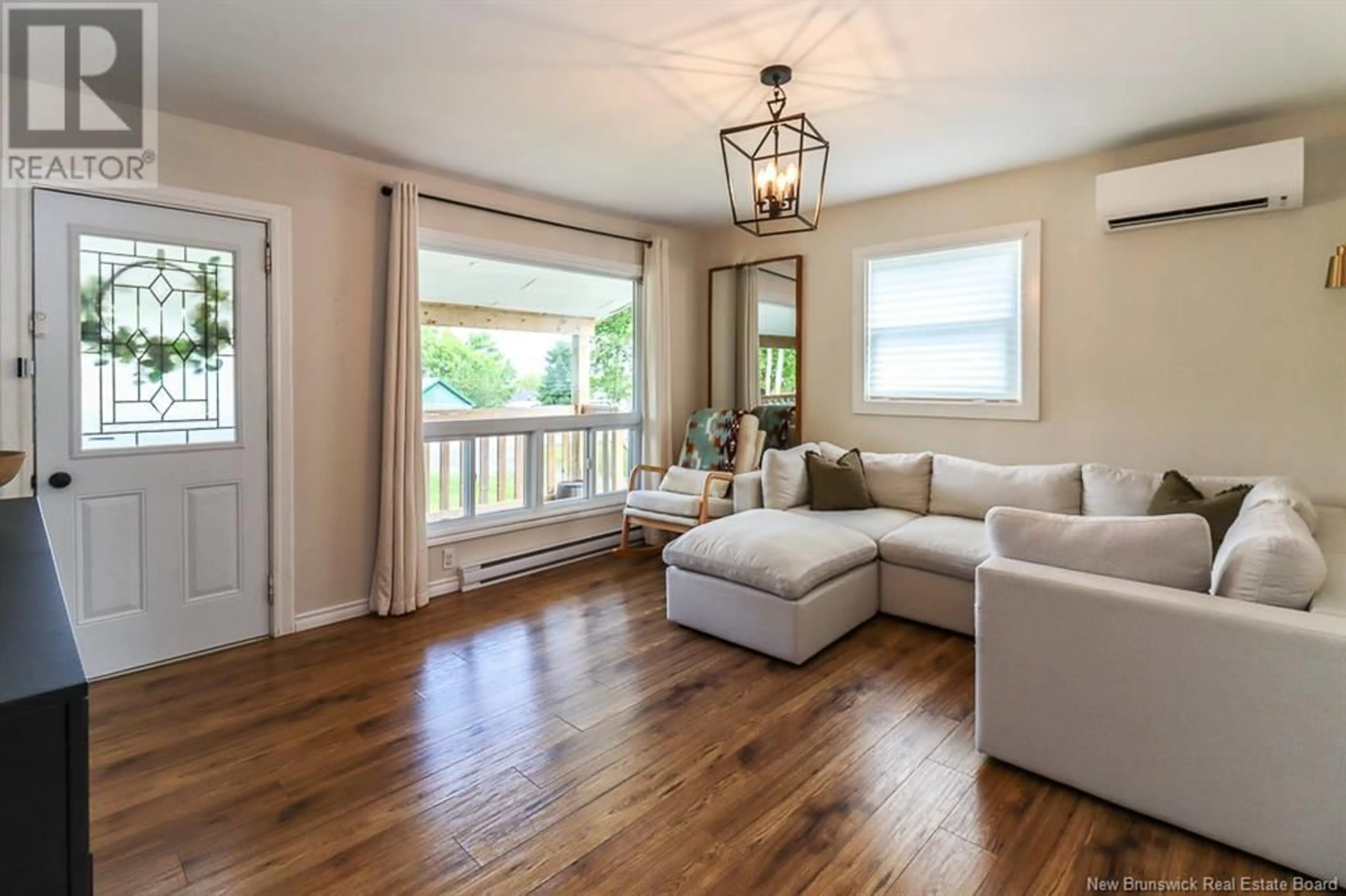 Living room with furniture, wood/laminate floor for 69 HAYES AVENUE, Saint John New Brunswick E2M5K2