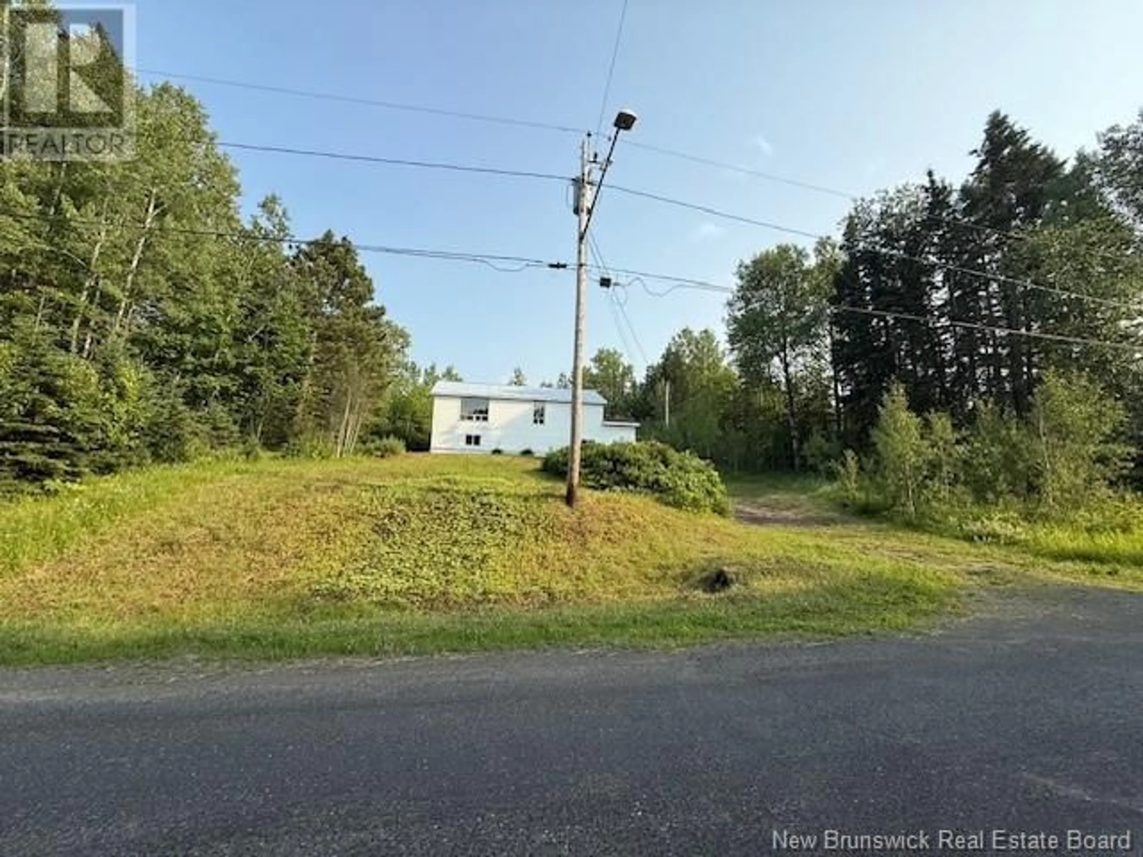 A pic from outside/outdoor area/front of a property/back of a property/a pic from drone, unknown for 131 MALENFANT ROAD, Dundee New Brunswick E8E1W9