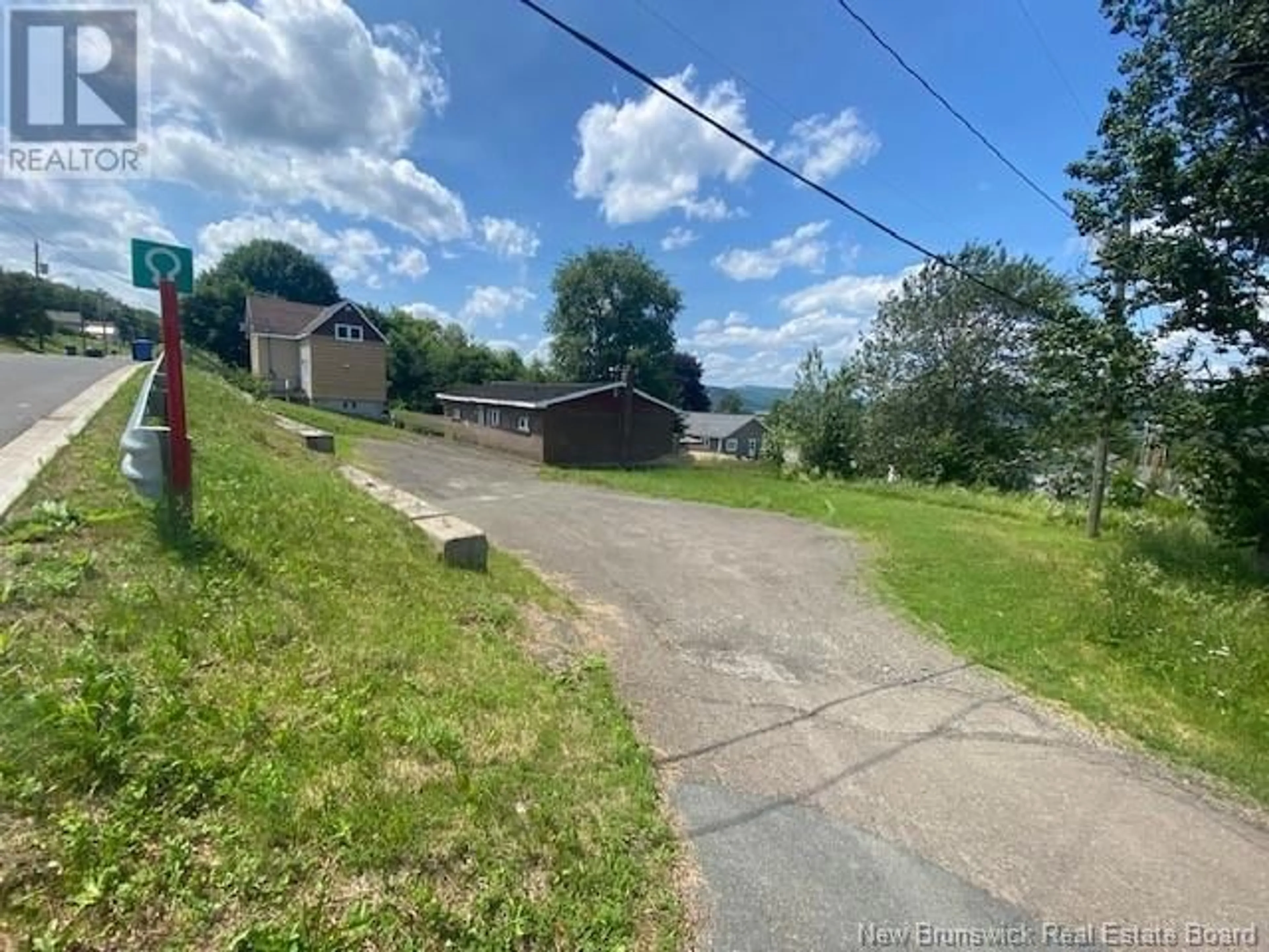 A pic from outside/outdoor area/front of a property/back of a property/a pic from drone, street for 311 PINEAULT STREET, Atholville New Brunswick E3N4A5