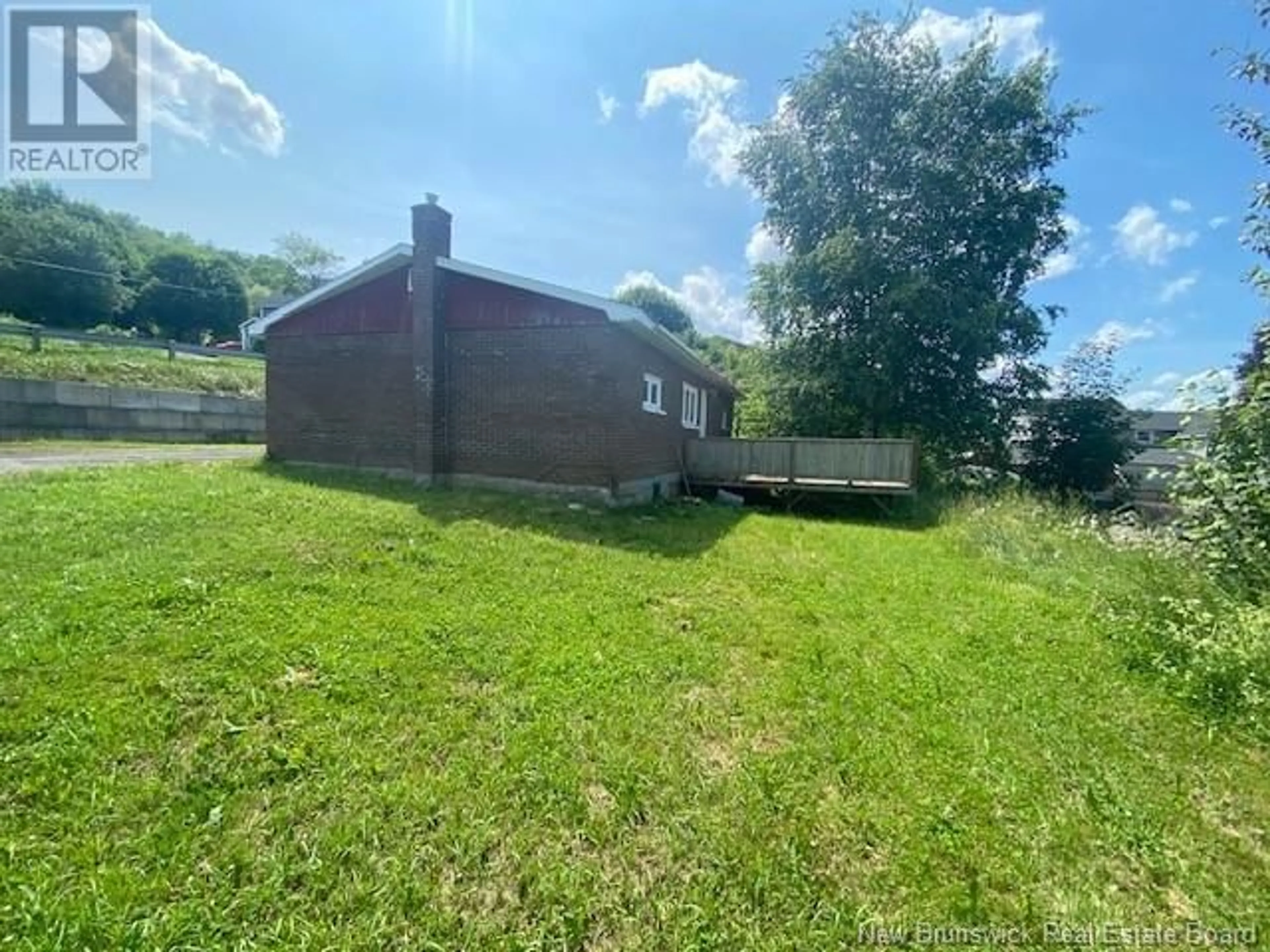 A pic from outside/outdoor area/front of a property/back of a property/a pic from drone, unknown for 311 PINEAULT STREET, Atholville New Brunswick E3N4A5