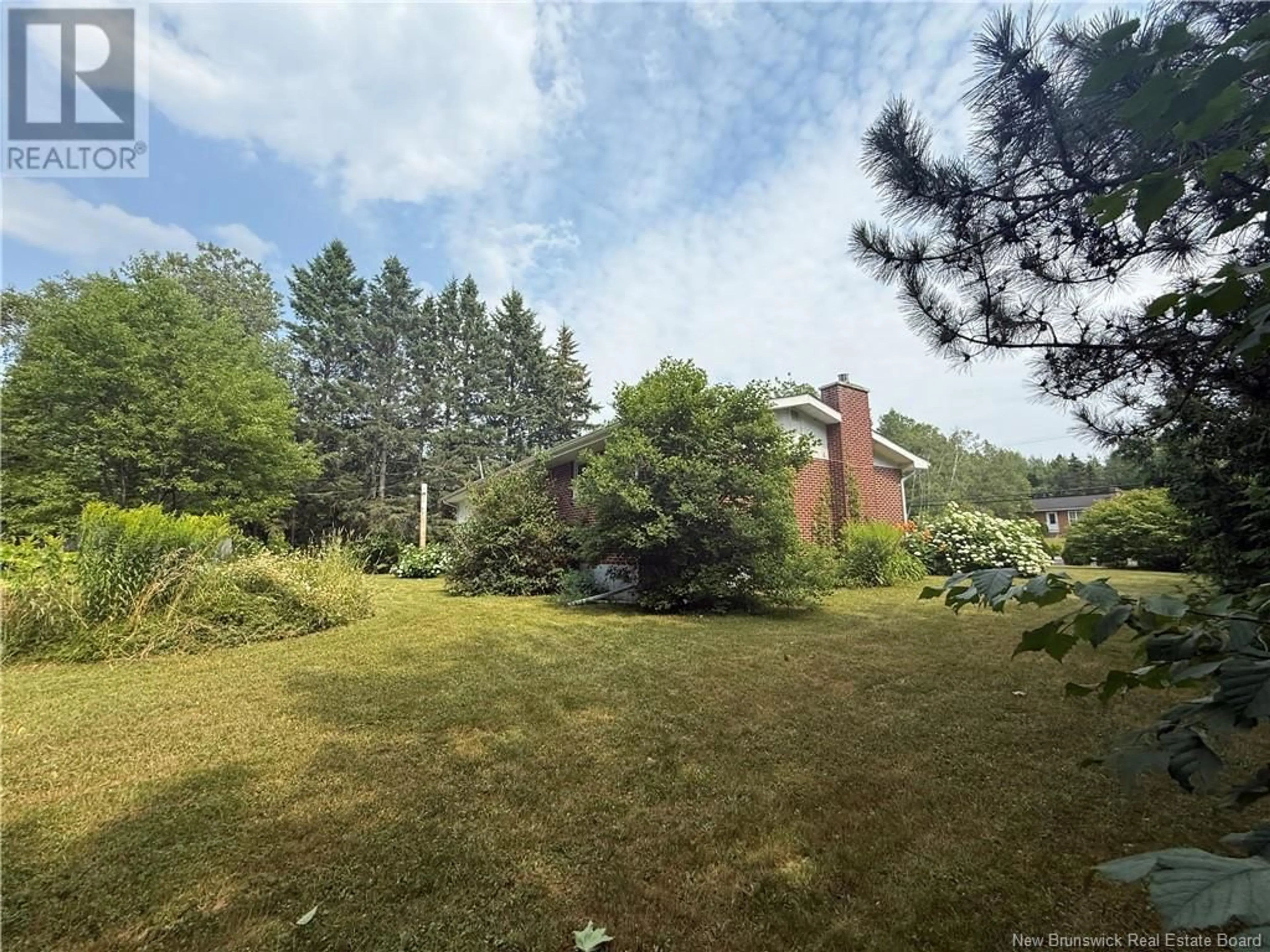 A pic from outside/outdoor area/front of a property/back of a property/a pic from drone, forest/trees view for 603 WELLINGTON, Miramichi New Brunswick E1N3M1