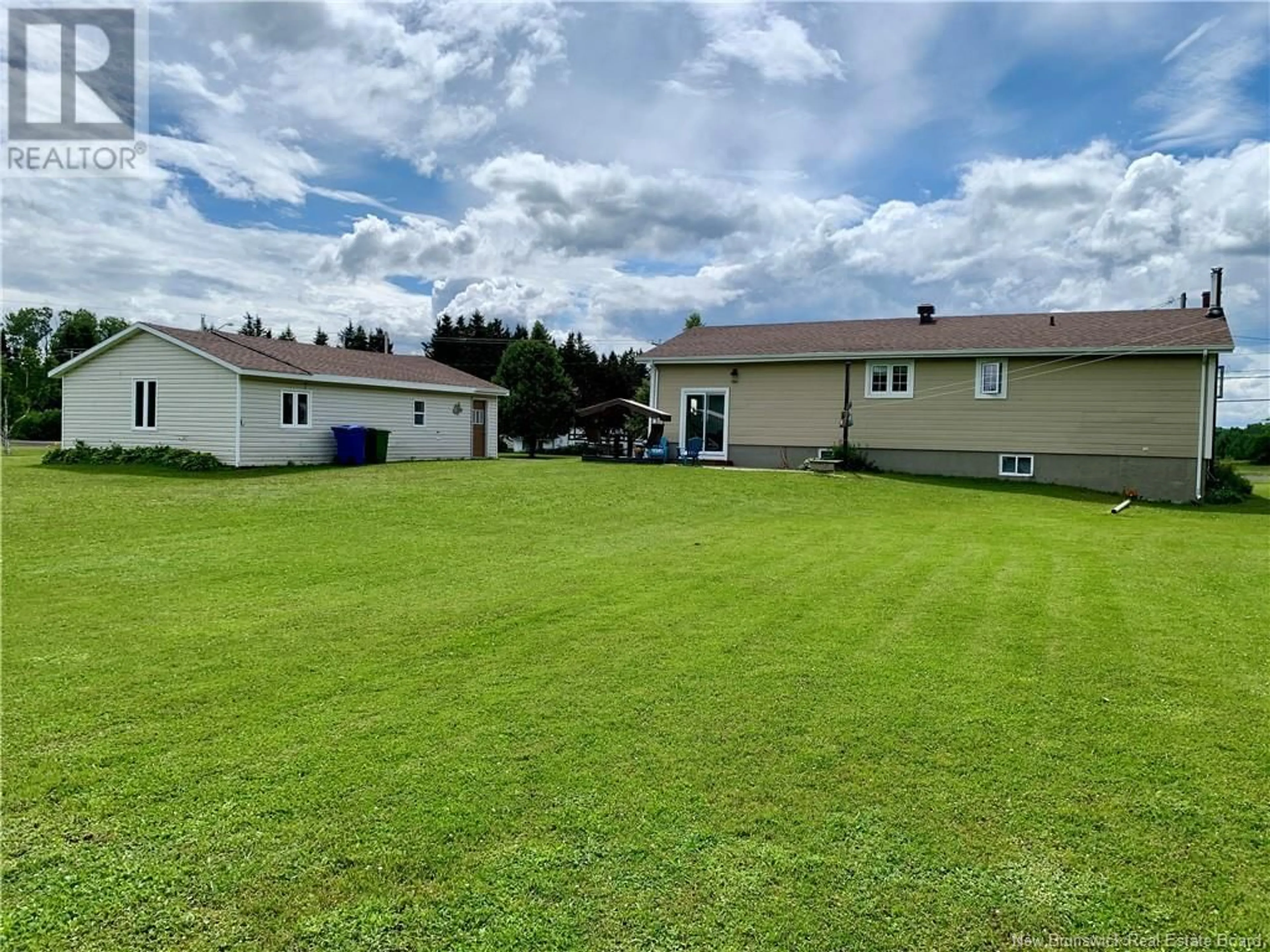 A pic from outside/outdoor area/front of a property/back of a property/a pic from drone, water/lake/river/ocean view for 117 MOUNTAIN BROOK, Charlo New Brunswick E8E2N4