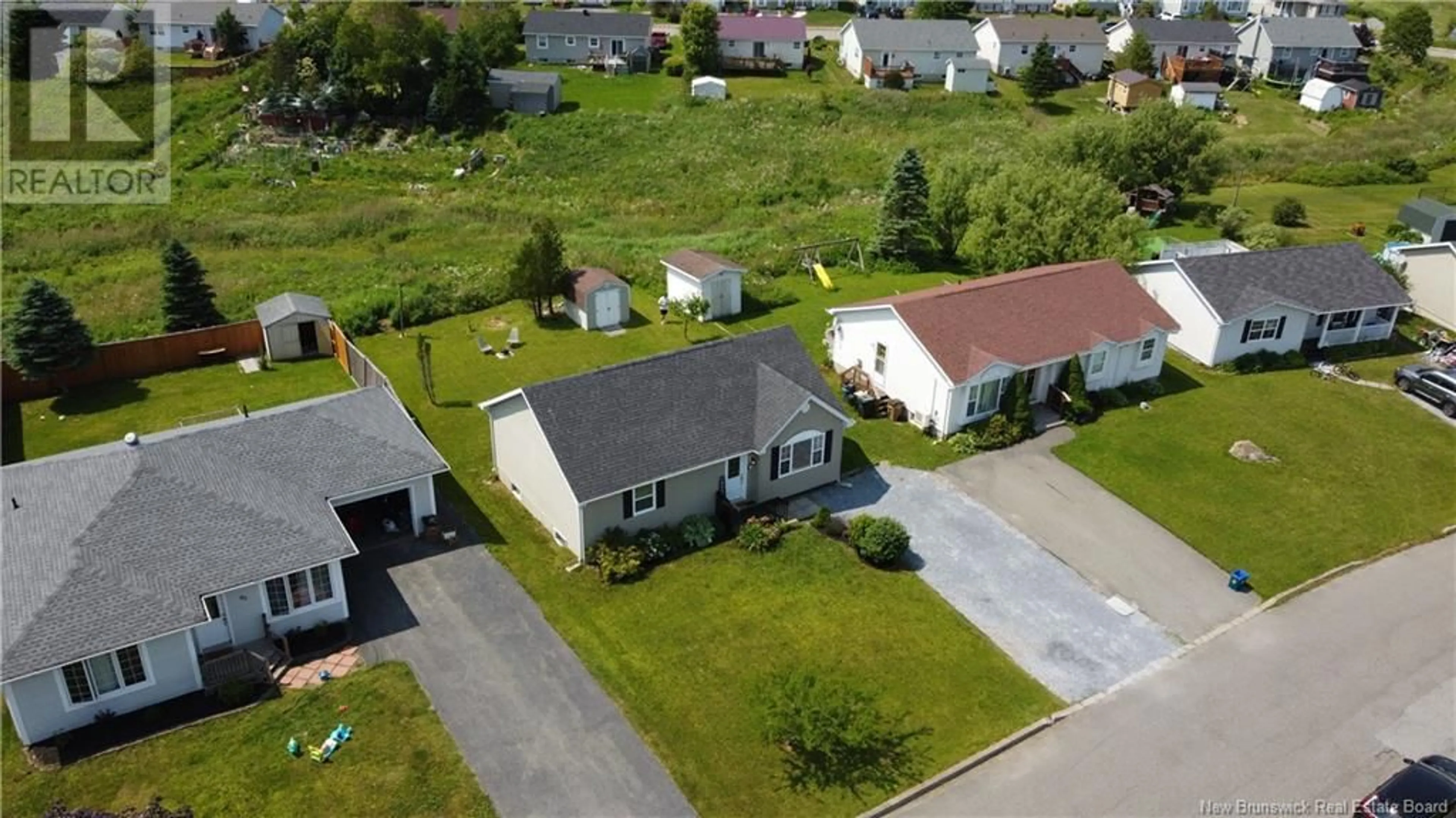 A pic from outside/outdoor area/front of a property/back of a property/a pic from drone, street for 89 HONEYSUCKLE DRIVE, Saint John New Brunswick E2M5T1