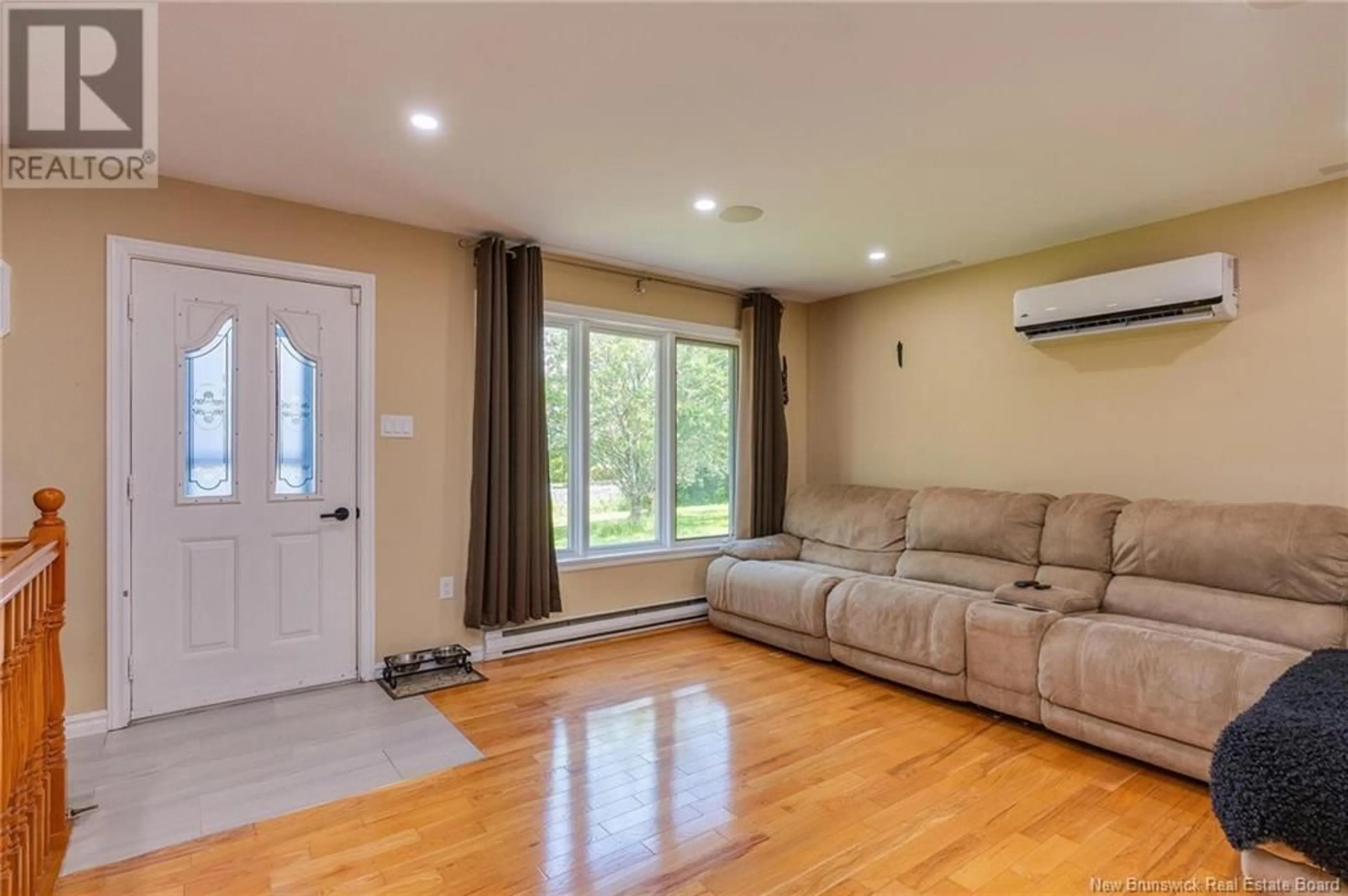 Living room with furniture, wood/laminate floor for 66 SUNNYBROOK TERRACE, Saint John New Brunswick E2J4L6