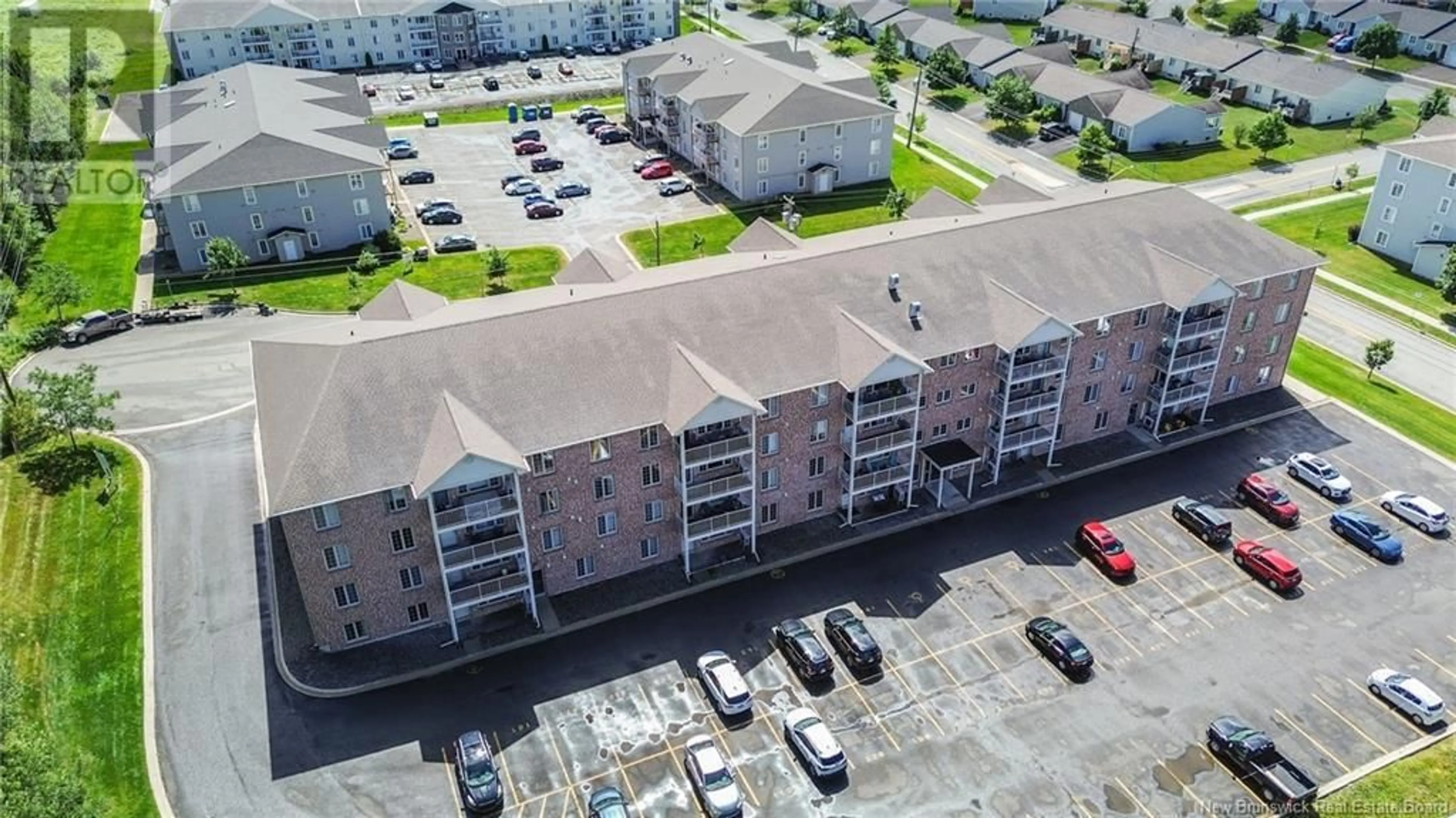 A pic from outside/outdoor area/front of a property/back of a property/a pic from drone, building for 107 - 165 VALCOUR, Fredericton New Brunswick E3C0H5