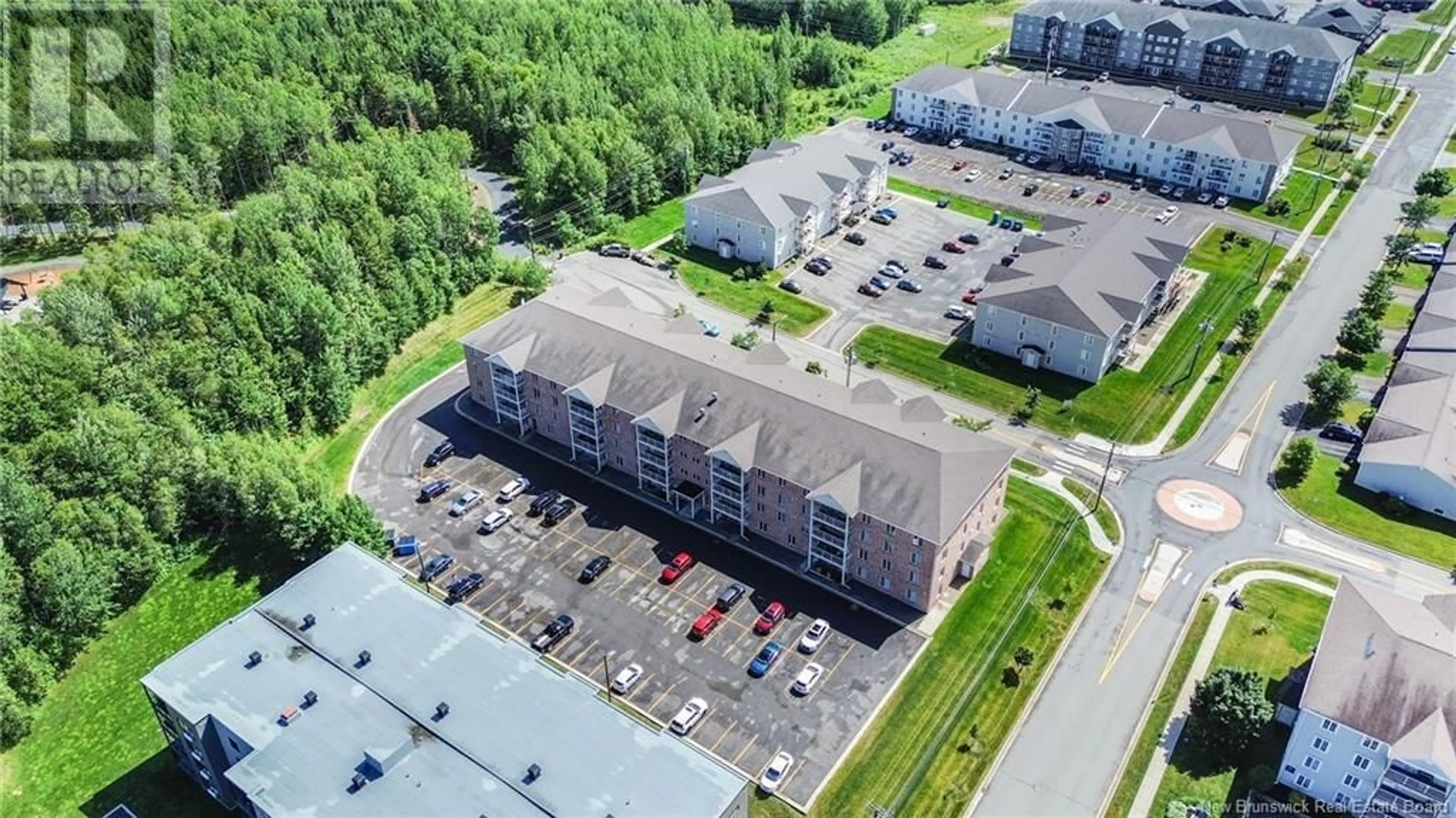 A pic from outside/outdoor area/front of a property/back of a property/a pic from drone, building for 107 - 165 VALCOUR, Fredericton New Brunswick E3C0H5