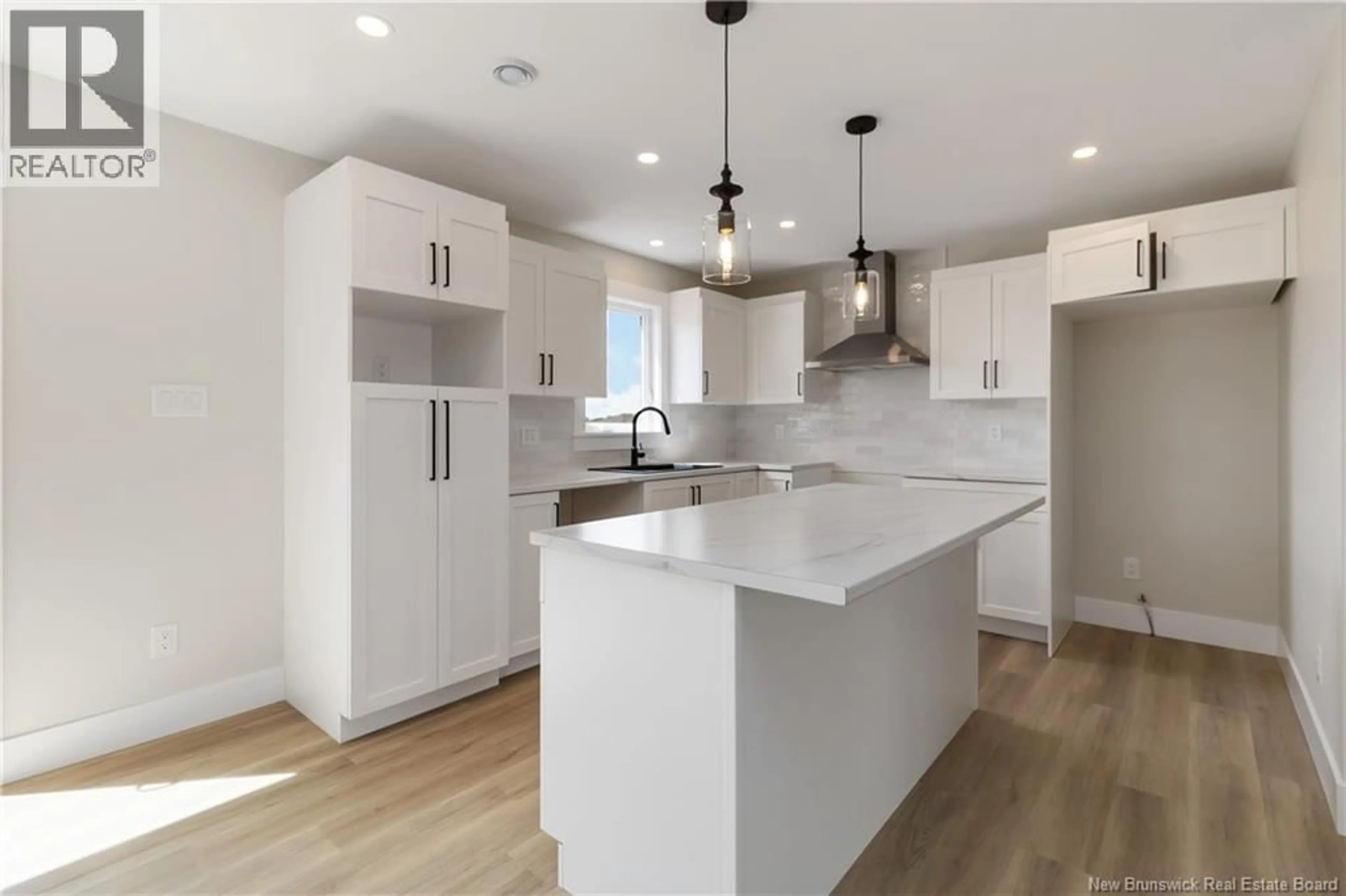 Open concept kitchen, wood/laminate floor for 74 ALOSIER CRESCENT, Moncton New Brunswick E1K0A1