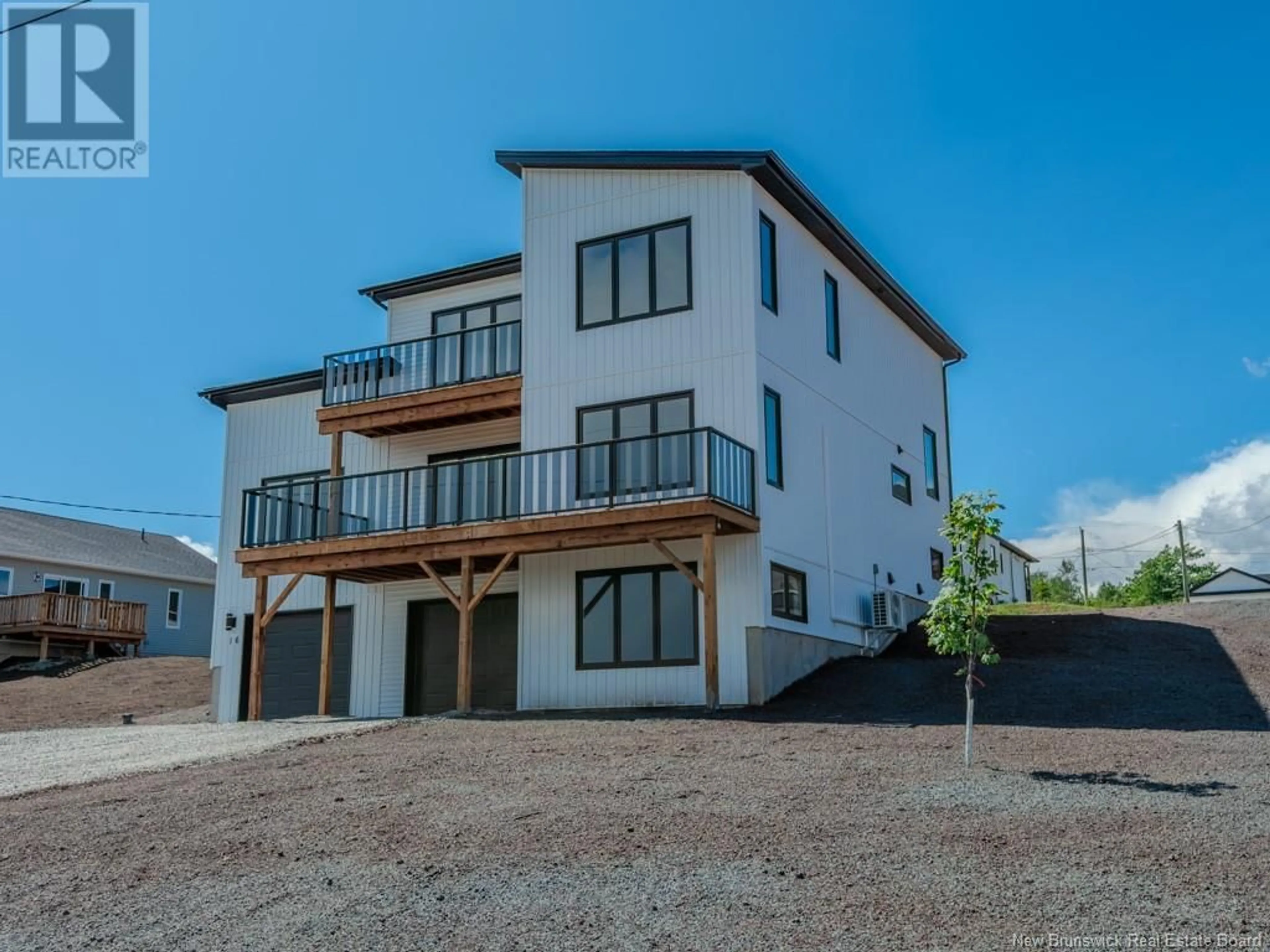 A pic from outside/outdoor area/front of a property/back of a property/a pic from drone, water/lake/river/ocean view for 16 GROSBEAK DRIVE, Quispamsis New Brunswick E2E0T3