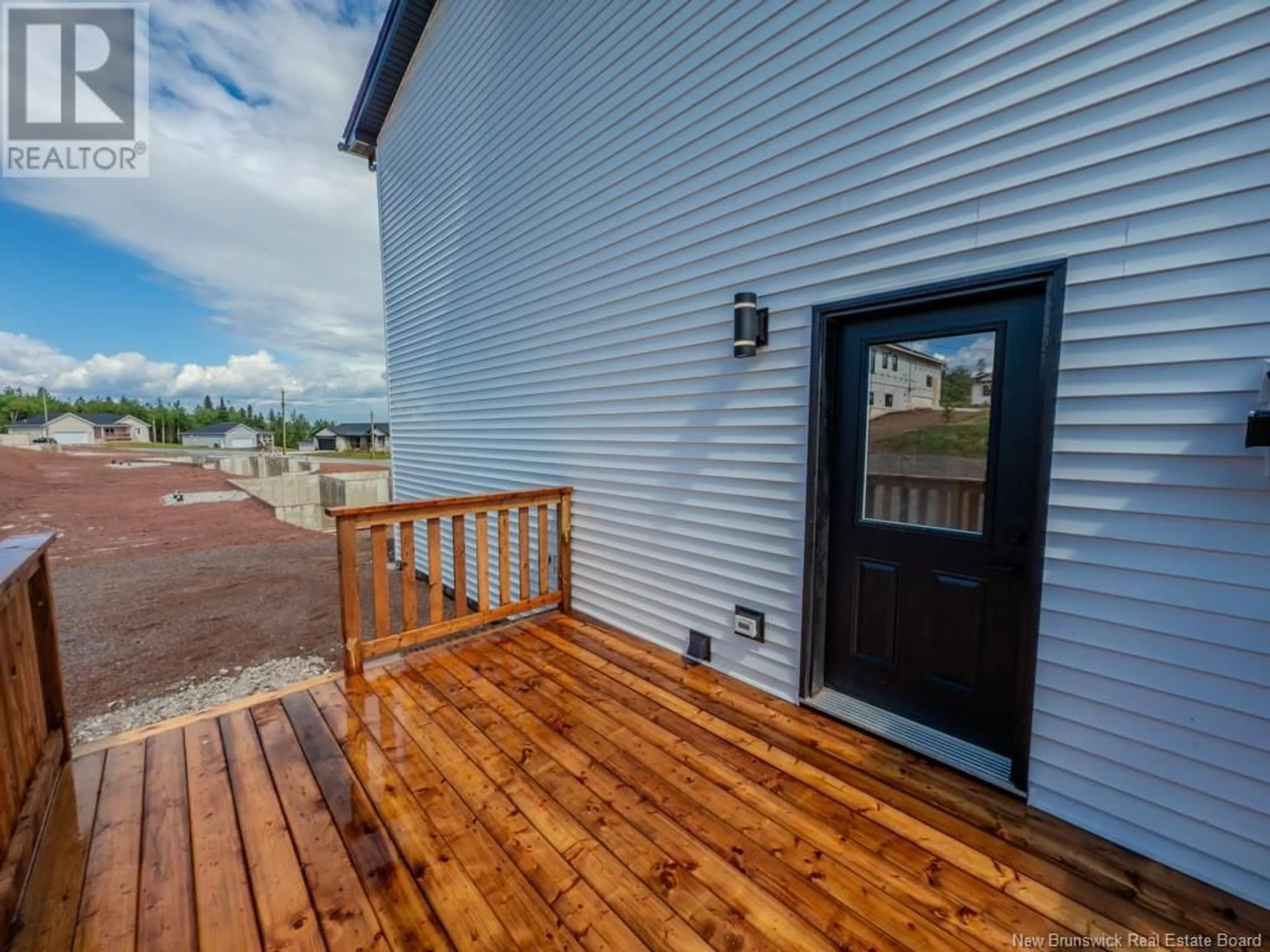 Home with vinyl exterior material, street for 16 GROSBEAK DRIVE, Quispamsis New Brunswick E2E0T3