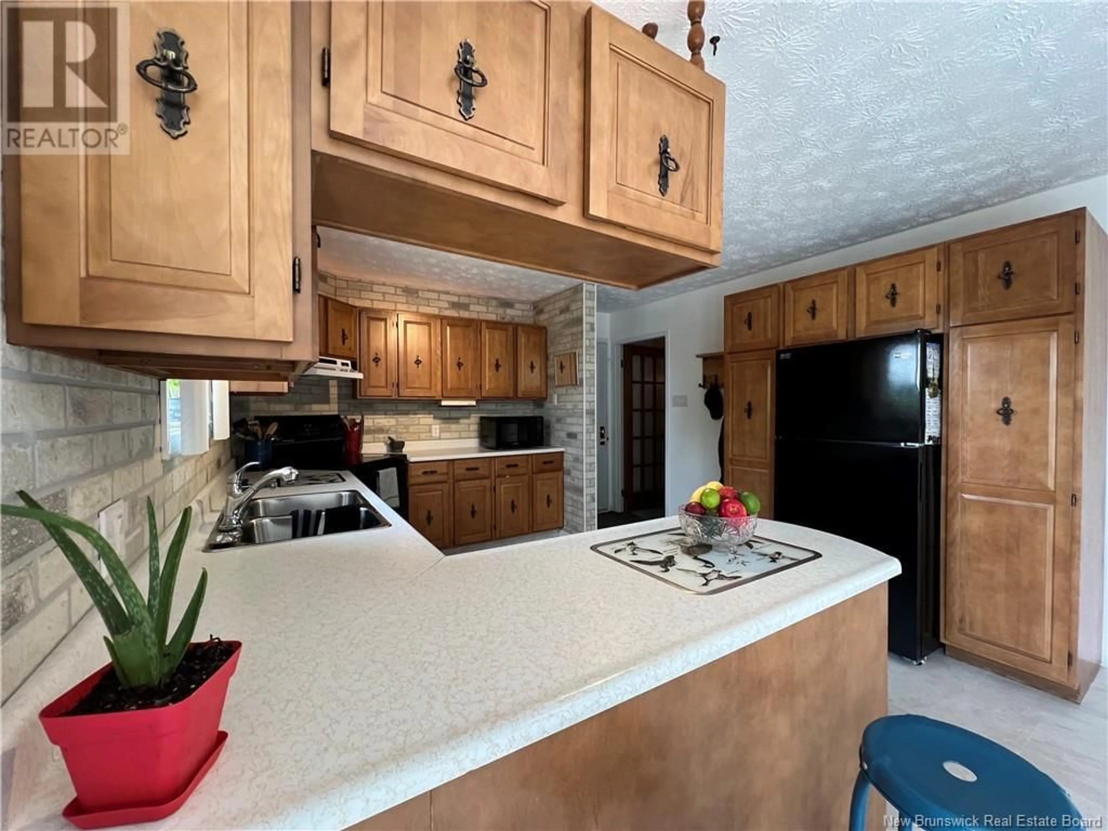Open concept kitchen, ceramic/tile floor for 43 OUELLETTE STREET, Saint-Jacques New Brunswick E7B1N1