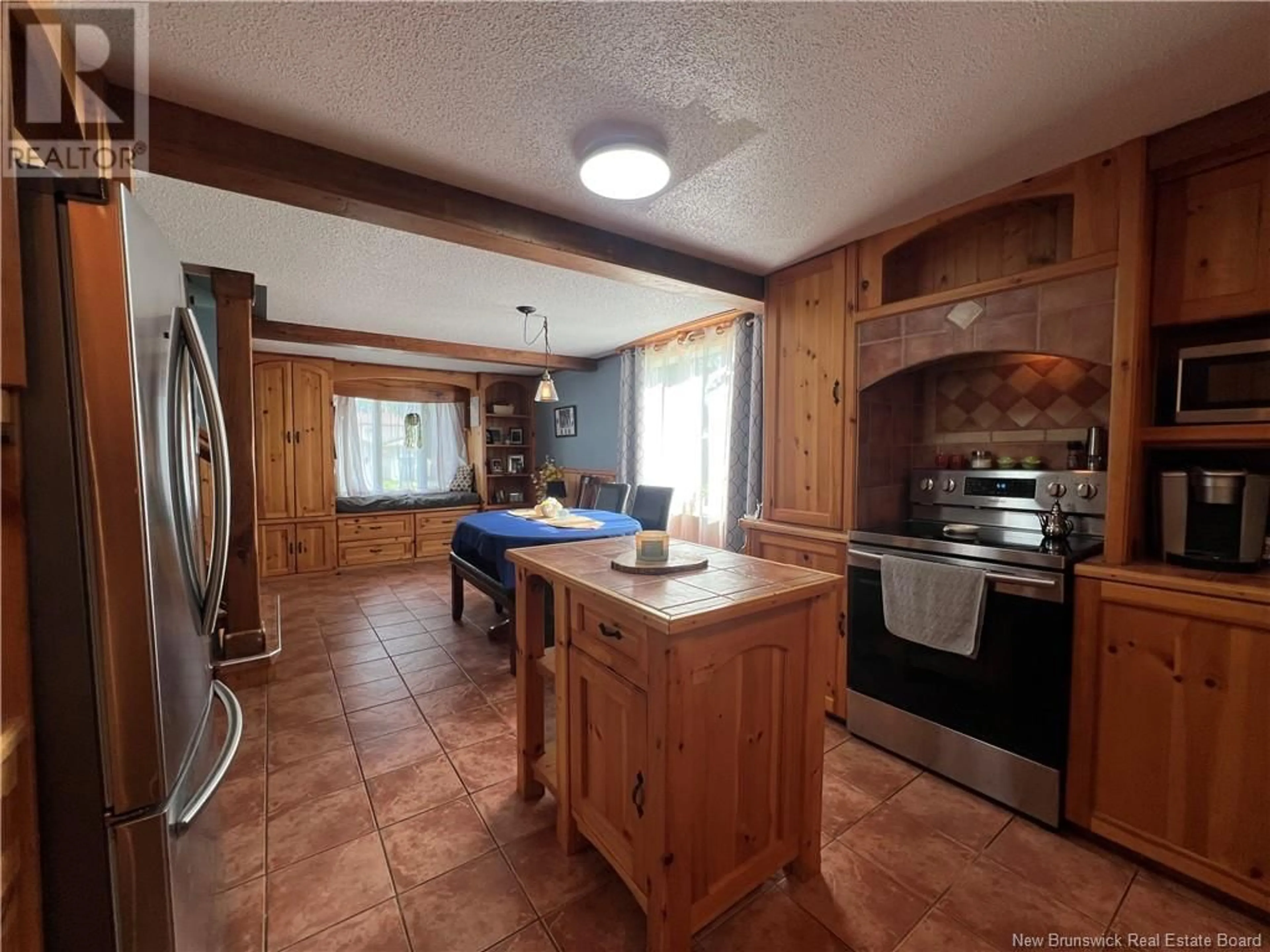 Open concept kitchen, ceramic/tile floor for 55 VENIOT STREET, Edmundston New Brunswick E3V1L3