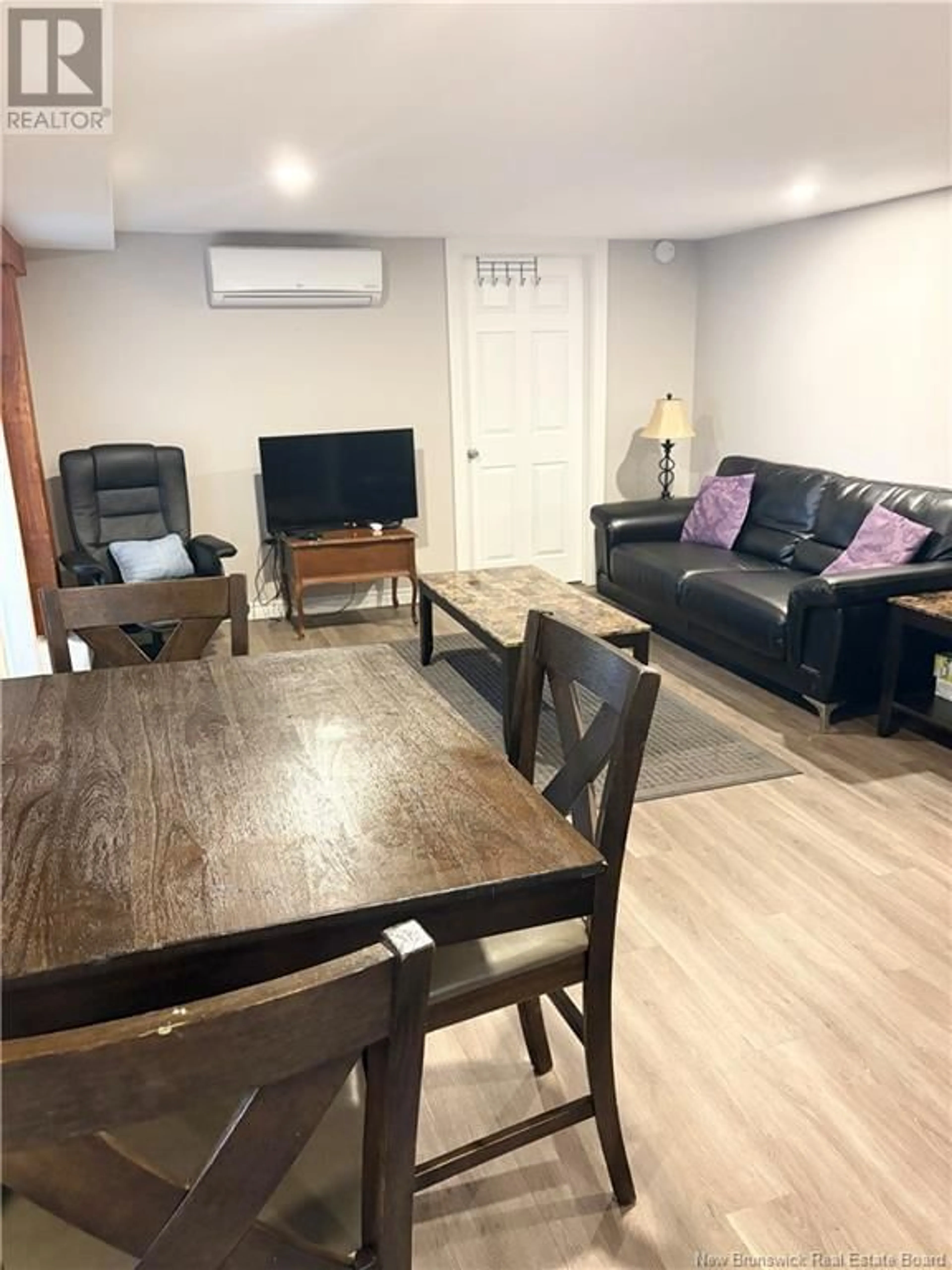 Living room with furniture, wood/laminate floor for 73 MAPLETON ROAD, Moncton New Brunswick E1C7W6