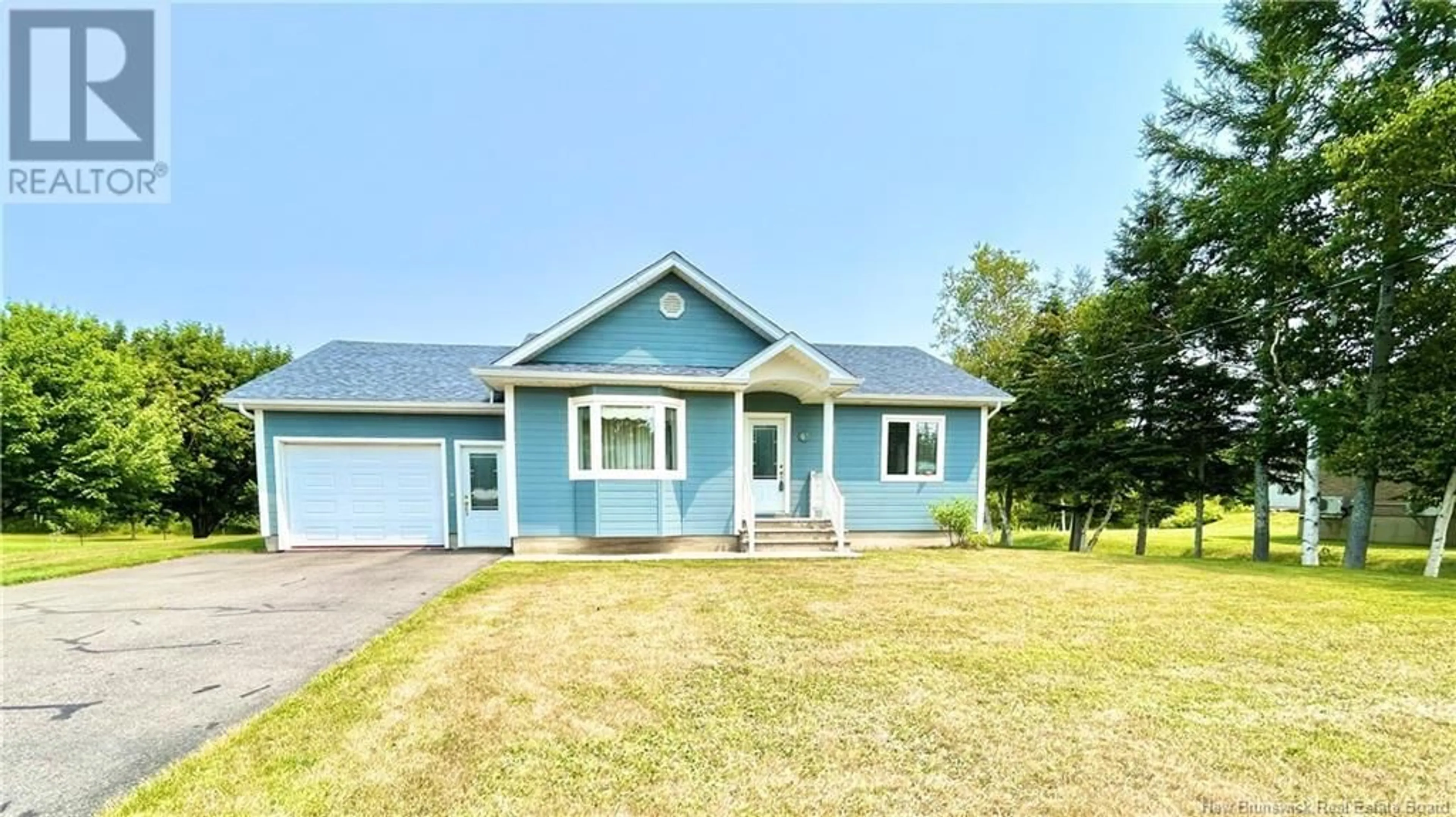 Home with vinyl exterior material, street for 61 SAINT-SIMON, Caraquet New Brunswick E1W1B3