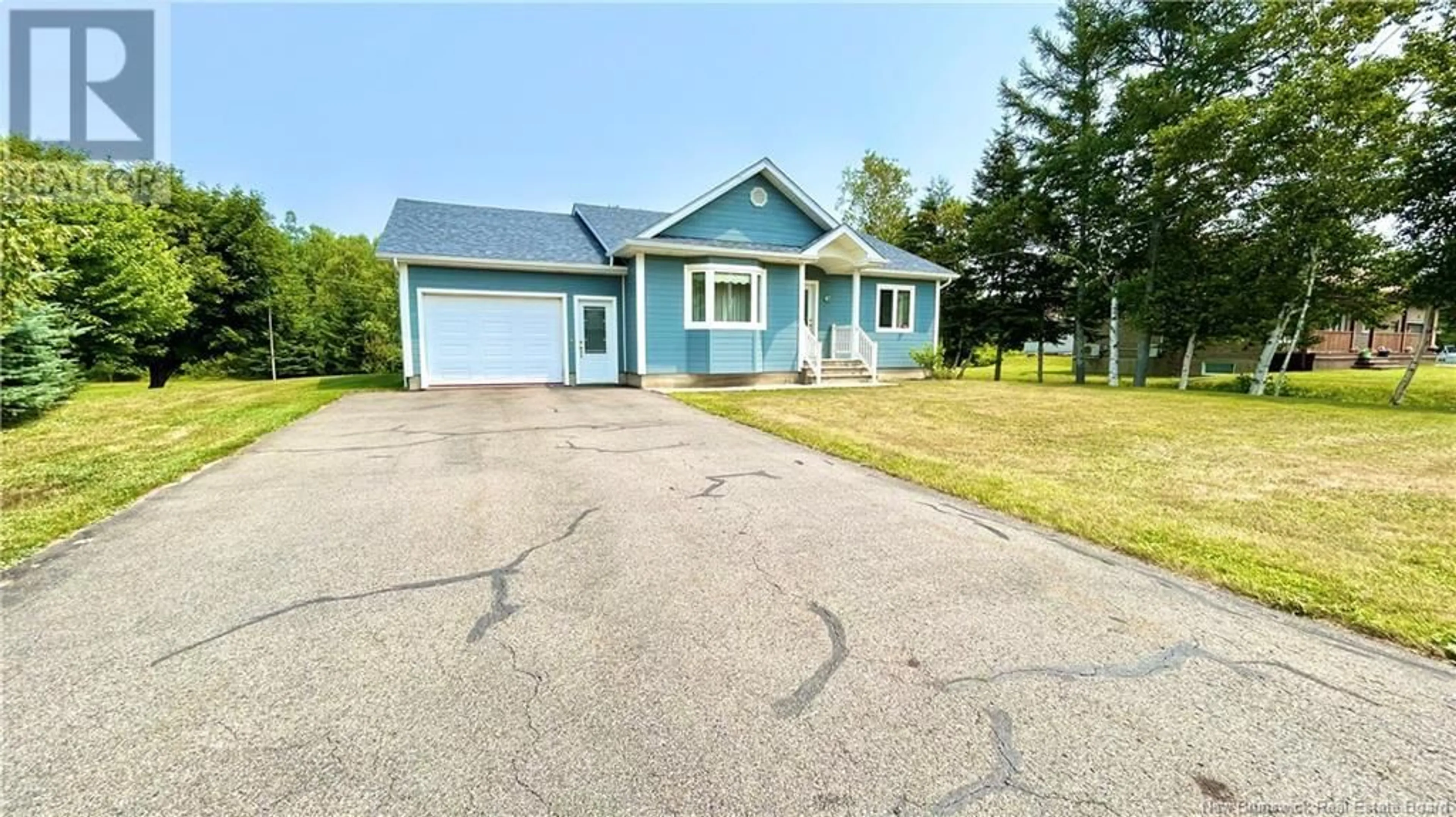 Home with vinyl exterior material, street for 61 SAINT-SIMON, Caraquet New Brunswick E1W1B3