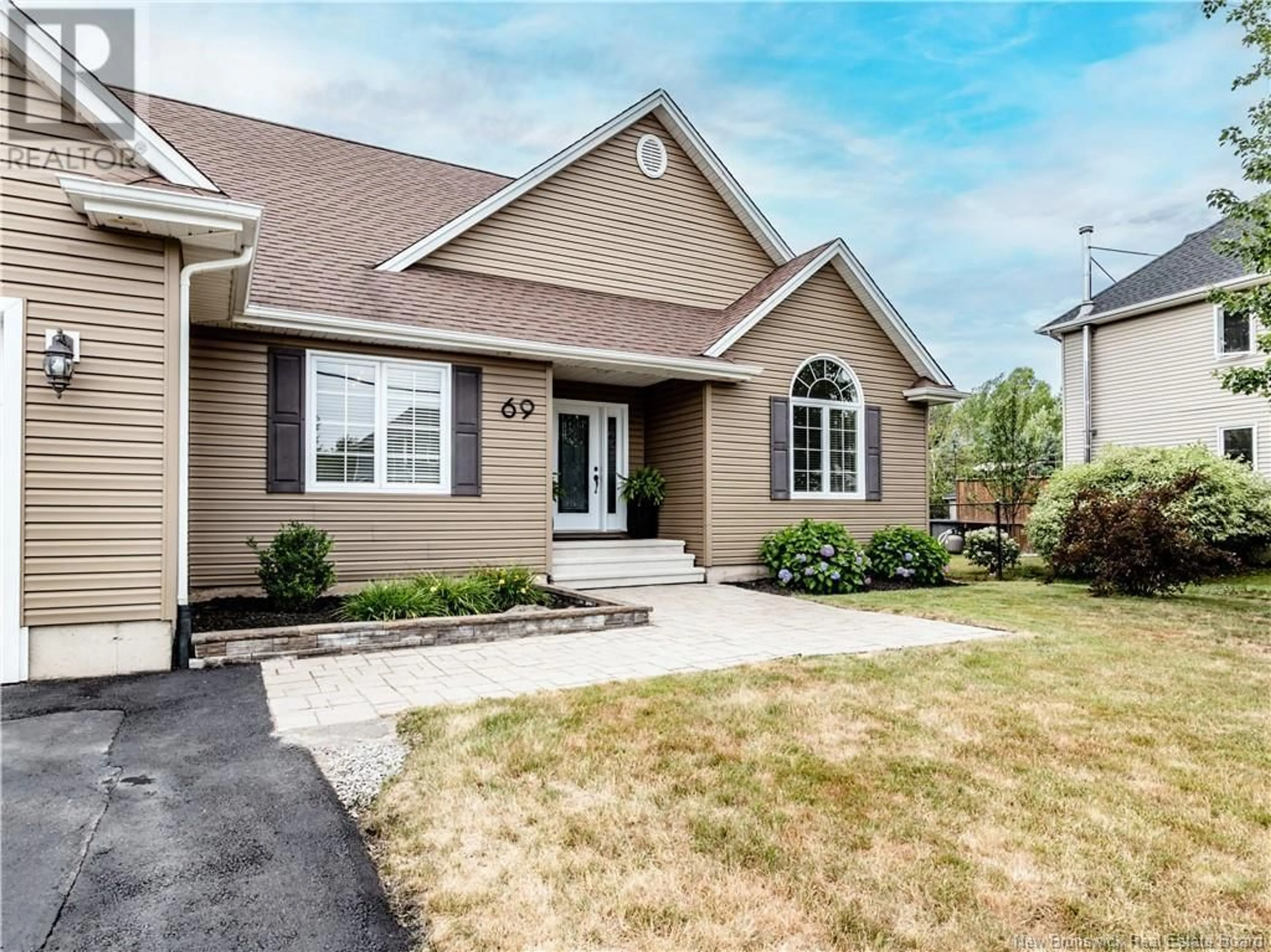 Home with vinyl exterior material, street for 69 RICHARD, Dieppe New Brunswick E1A0J9