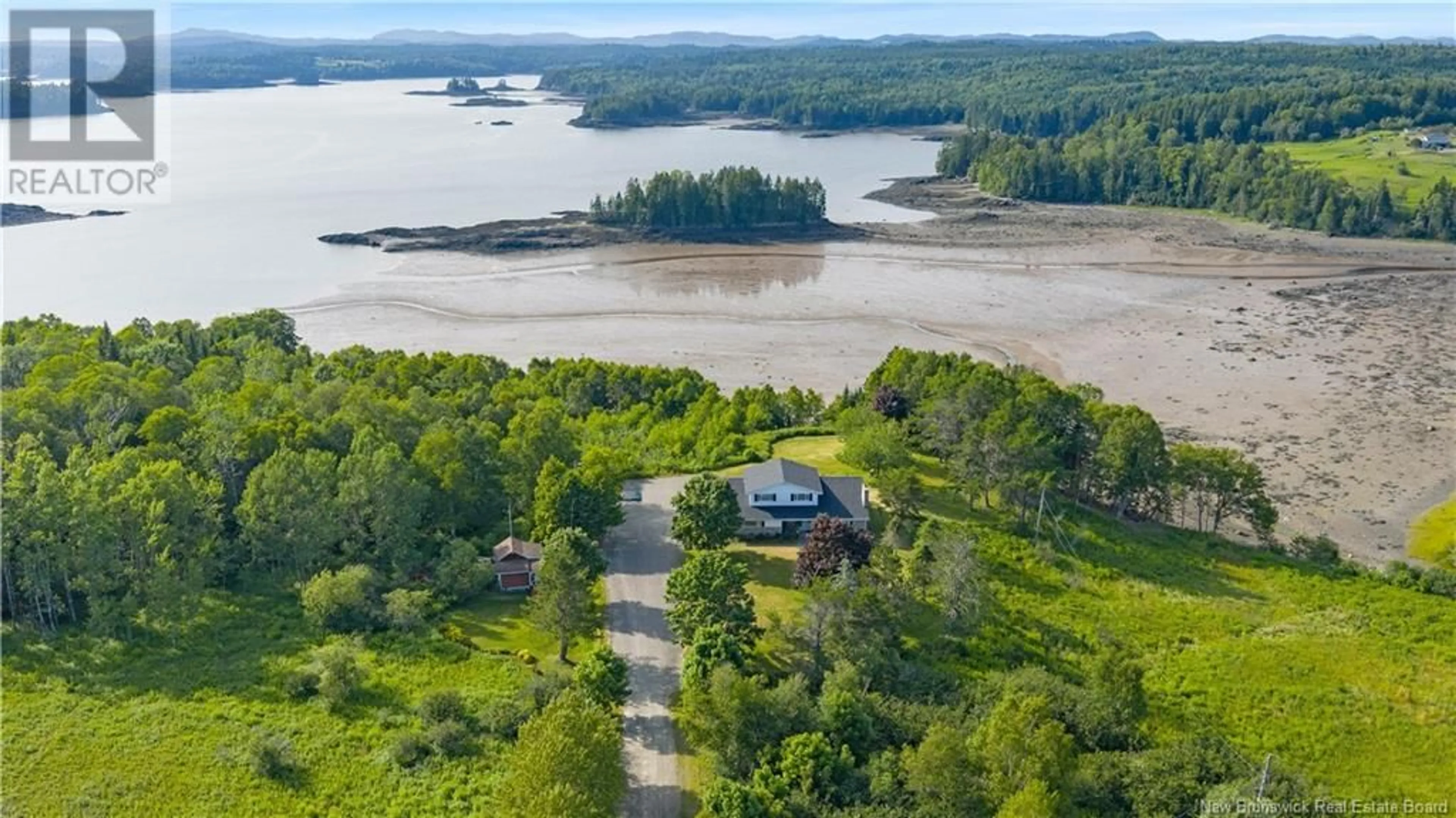 A pic from outside/outdoor area/front of a property/back of a property/a pic from drone, water/lake/river/ocean view for 100 NASON STREET, Blacks Harbour New Brunswick E5H1A3