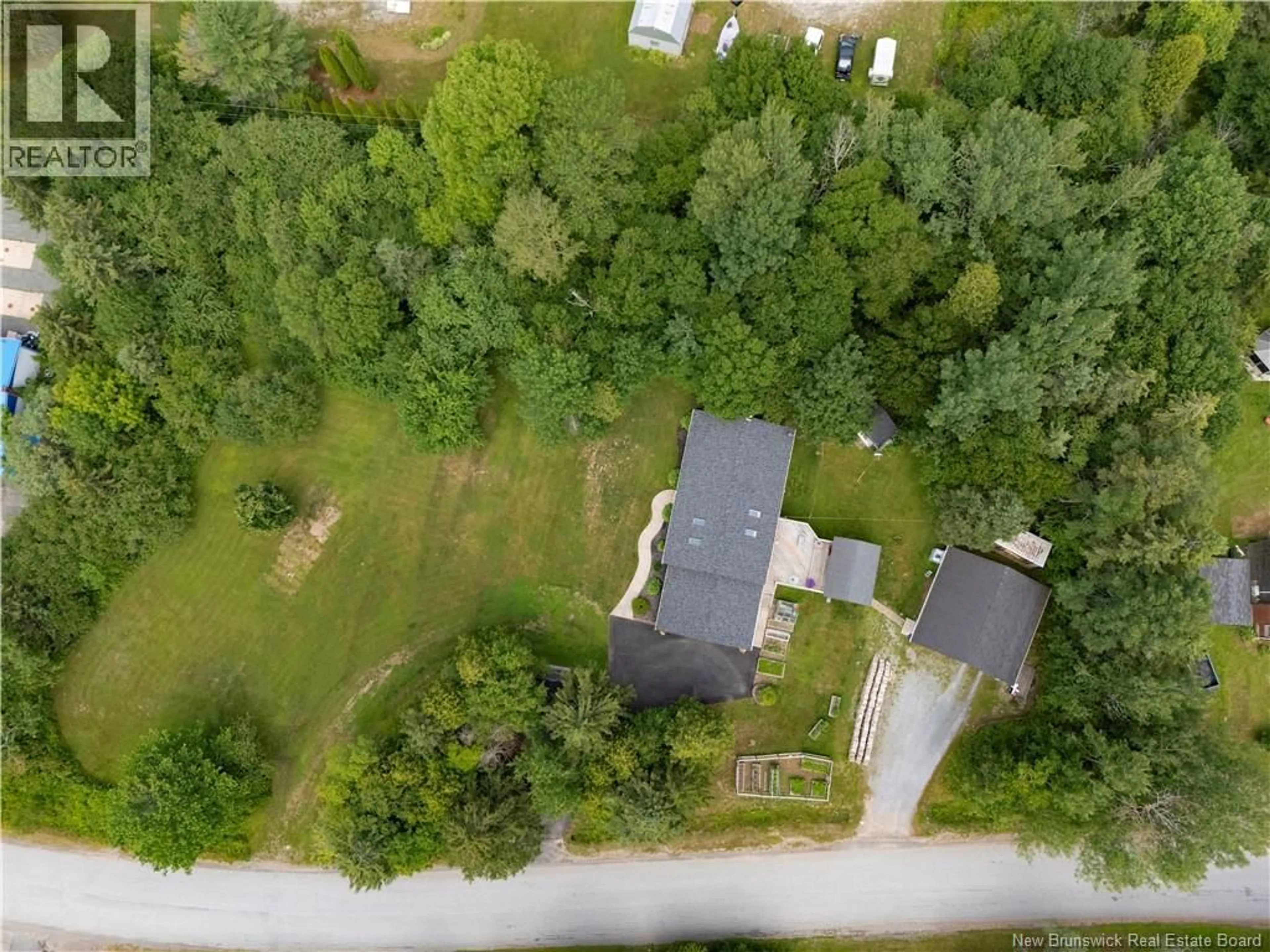 A pic from outside/outdoor area/front of a property/back of a property/a pic from drone, forest/trees view for 5 VAUGHAN DRIVE, Nauwigewauk New Brunswick E5N6T9