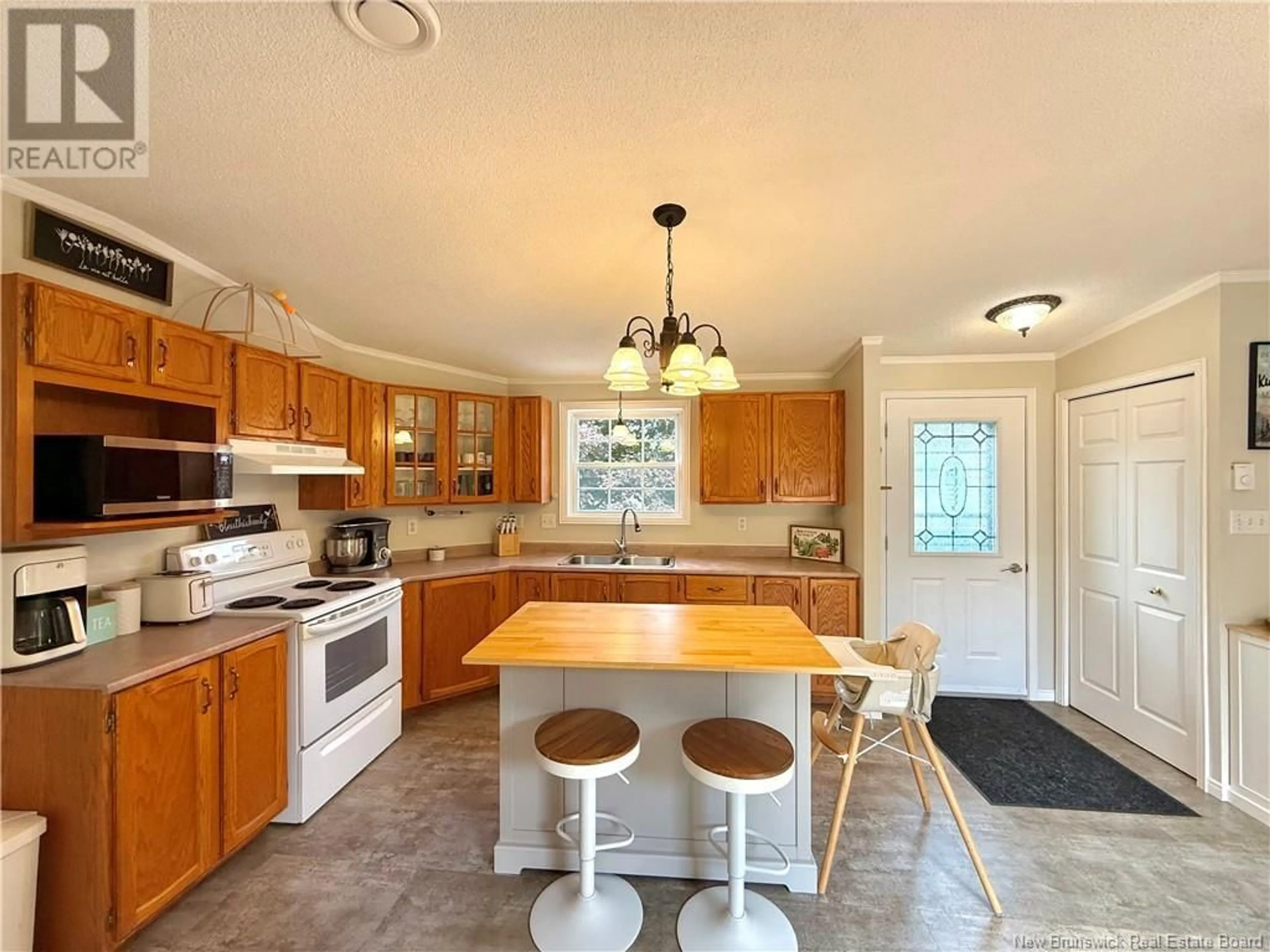 Open concept kitchen, ceramic/tile floor for 32 MAPLE GREEN CRESCENT, Dalhousie Junction New Brunswick E3N5Z3