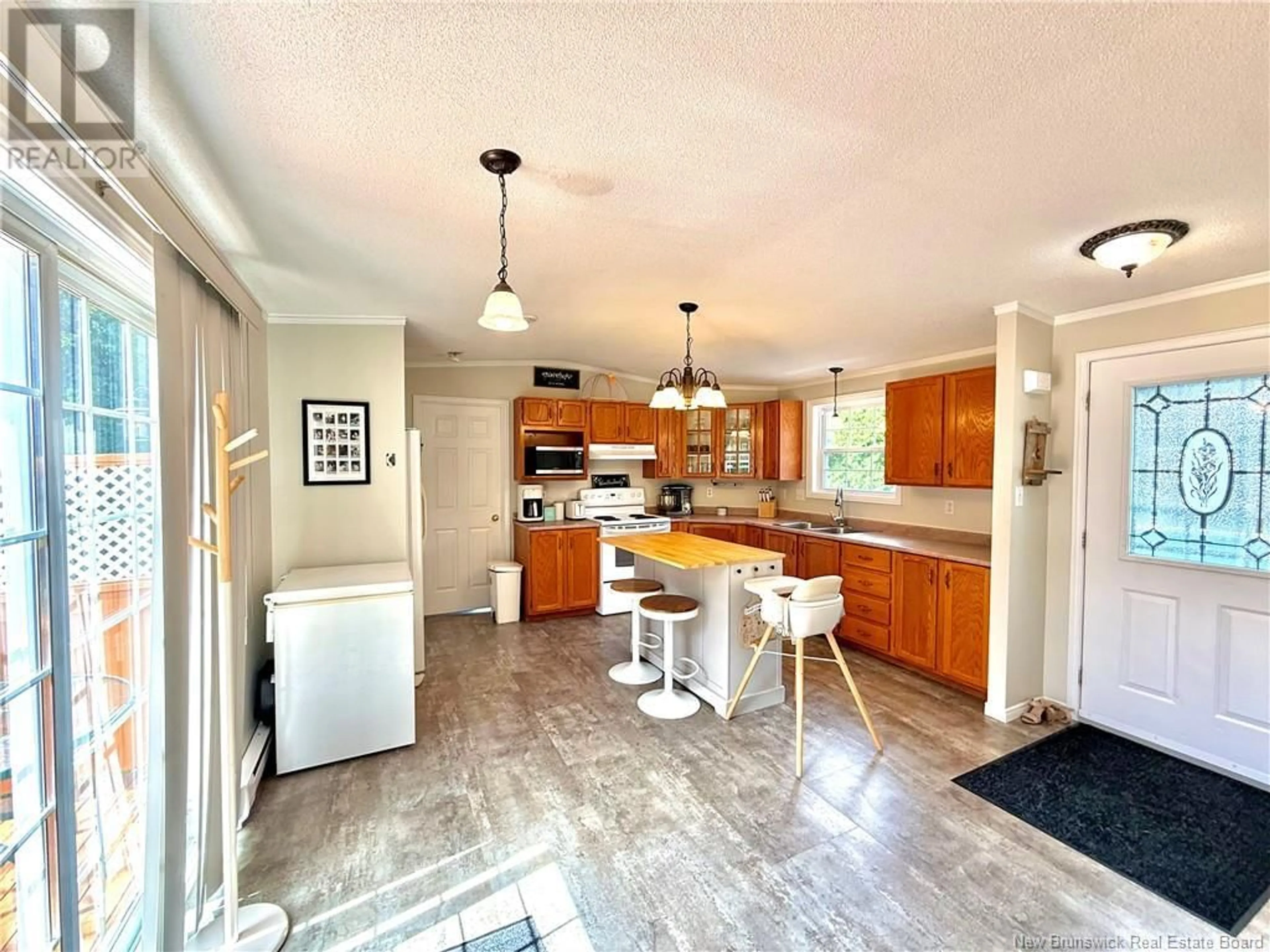 Open concept kitchen, ceramic/tile floor for 32 MAPLE GREEN CRESCENT, Dalhousie Junction New Brunswick E3N5Z3