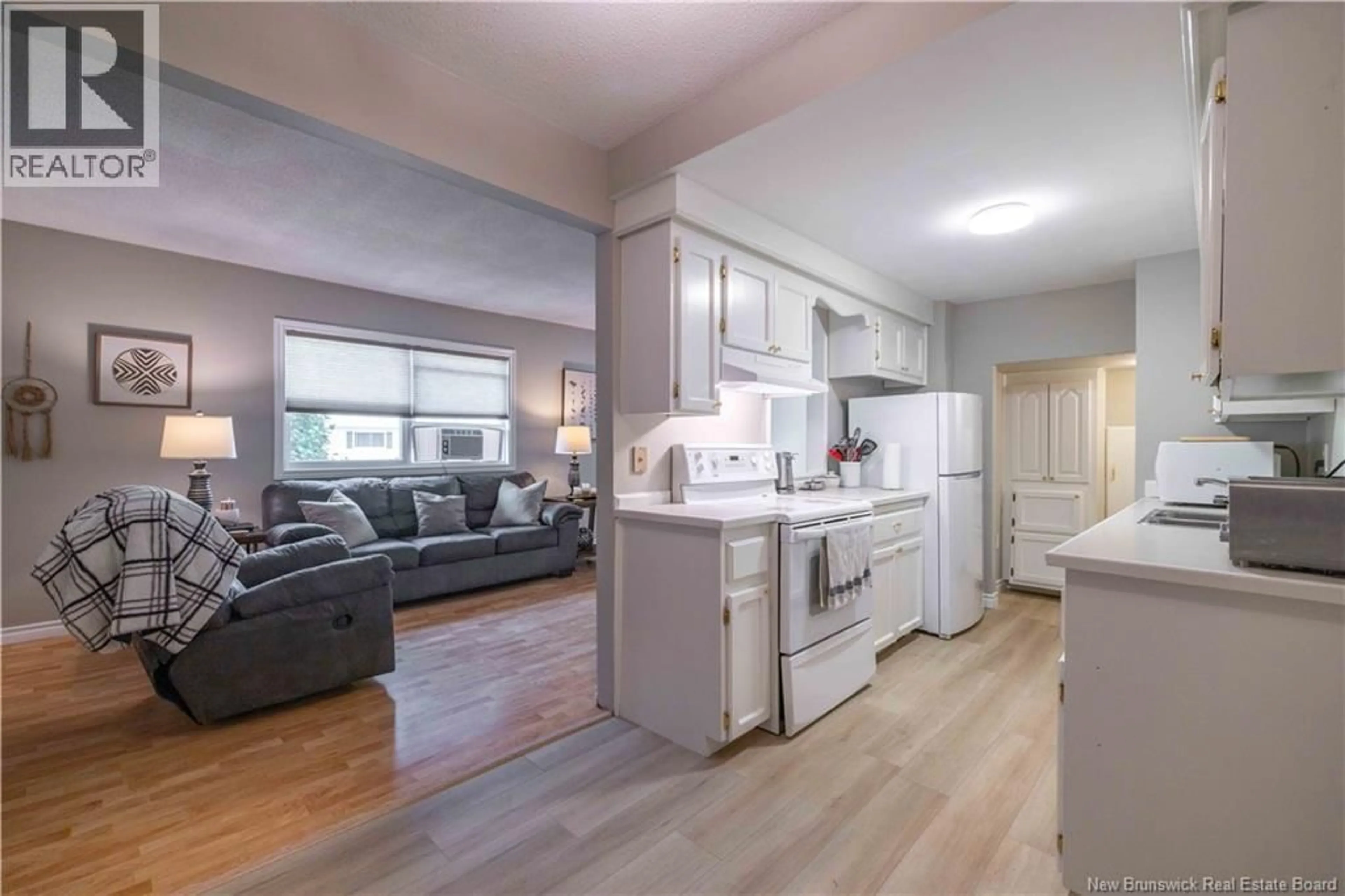 Open concept kitchen, wood/laminate floor for 120 TARTAN STREET, Saint John New Brunswick E2K2R7