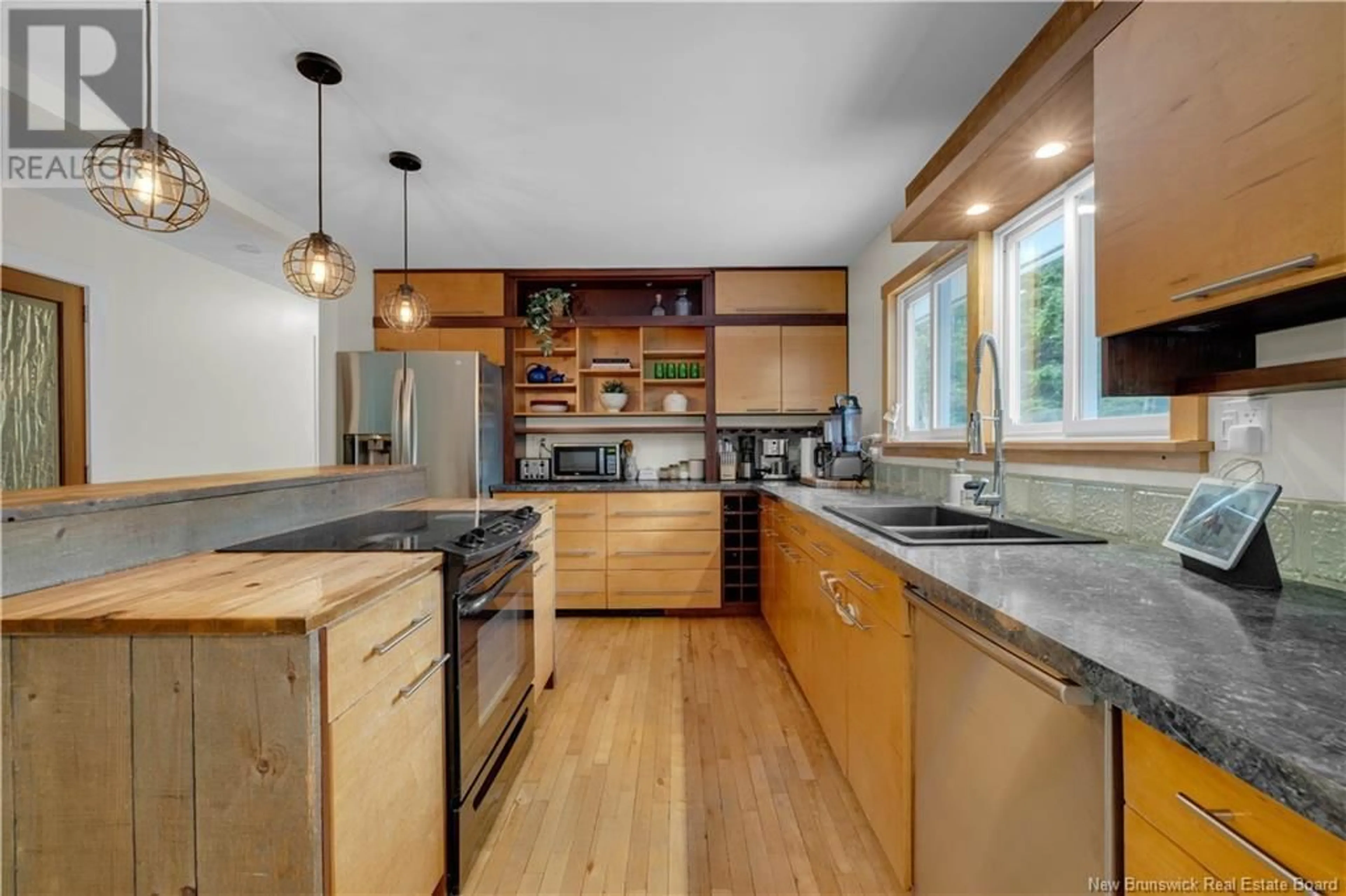 Open concept kitchen, wood/laminate floor for 26 ISLAY DRIVE, Rothesay New Brunswick E2E3J3