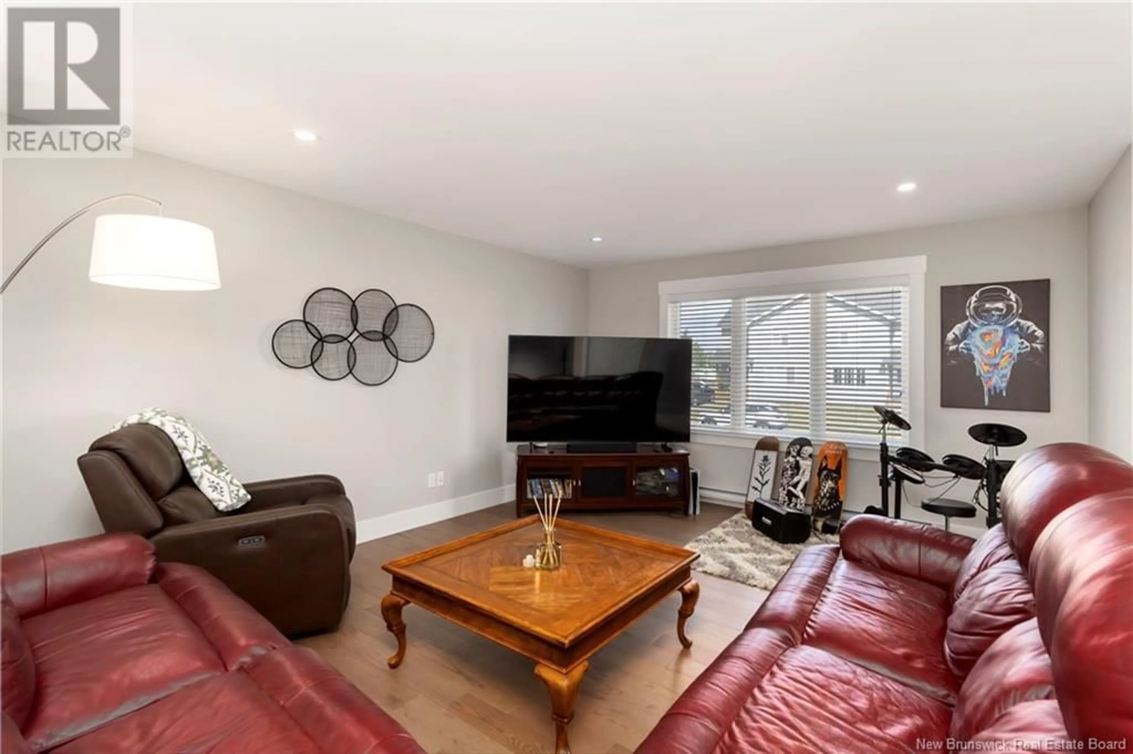 Living room with furniture, wood/laminate floor for 101 CROWBUSH CRESCENT, Moncton New Brunswick E1G0H1