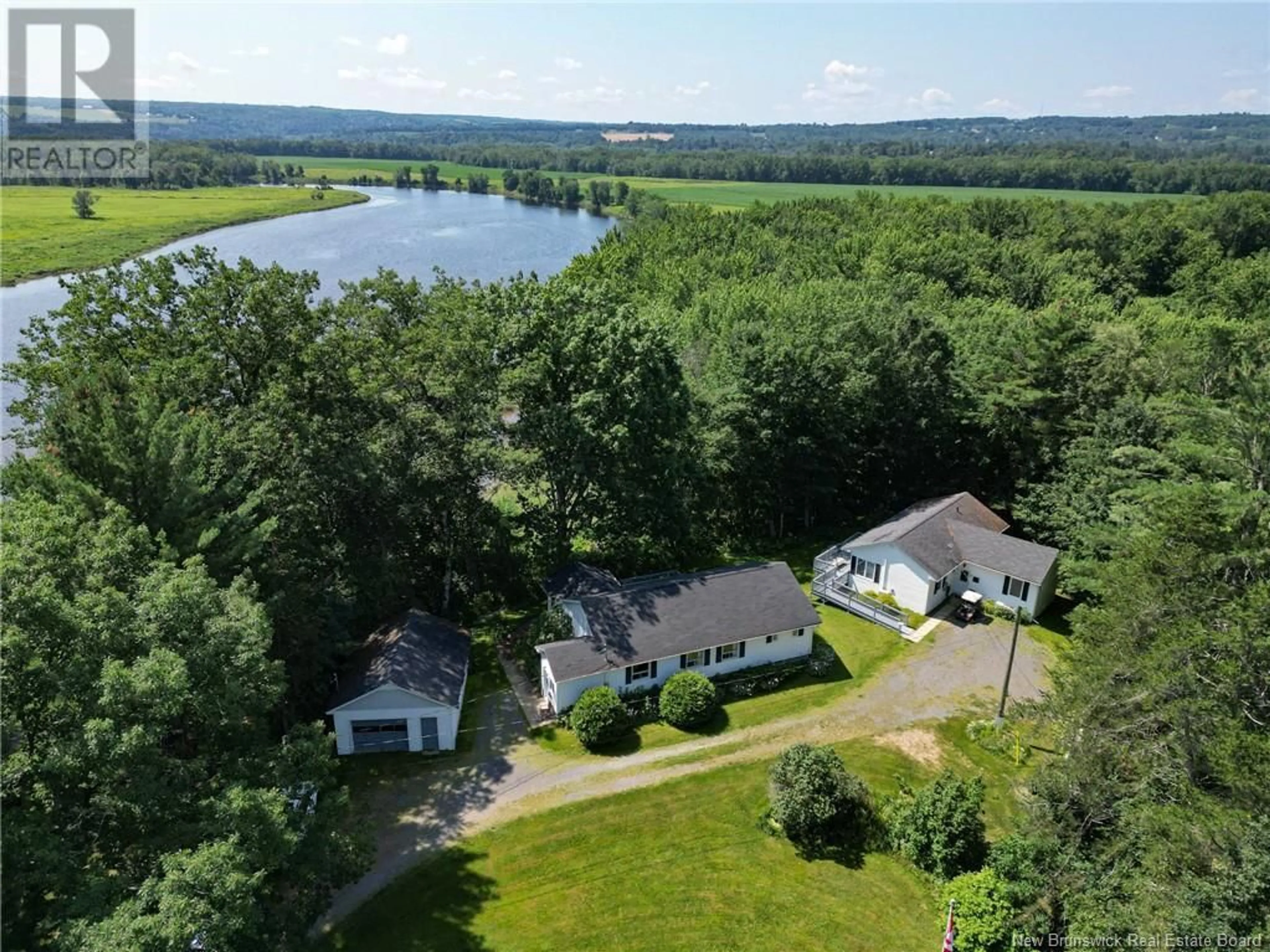 A pic from outside/outdoor area/front of a property/back of a property/a pic from drone, water/lake/river/ocean view for 20 NICHOLSON LANE, Douglas New Brunswick E3G7M1