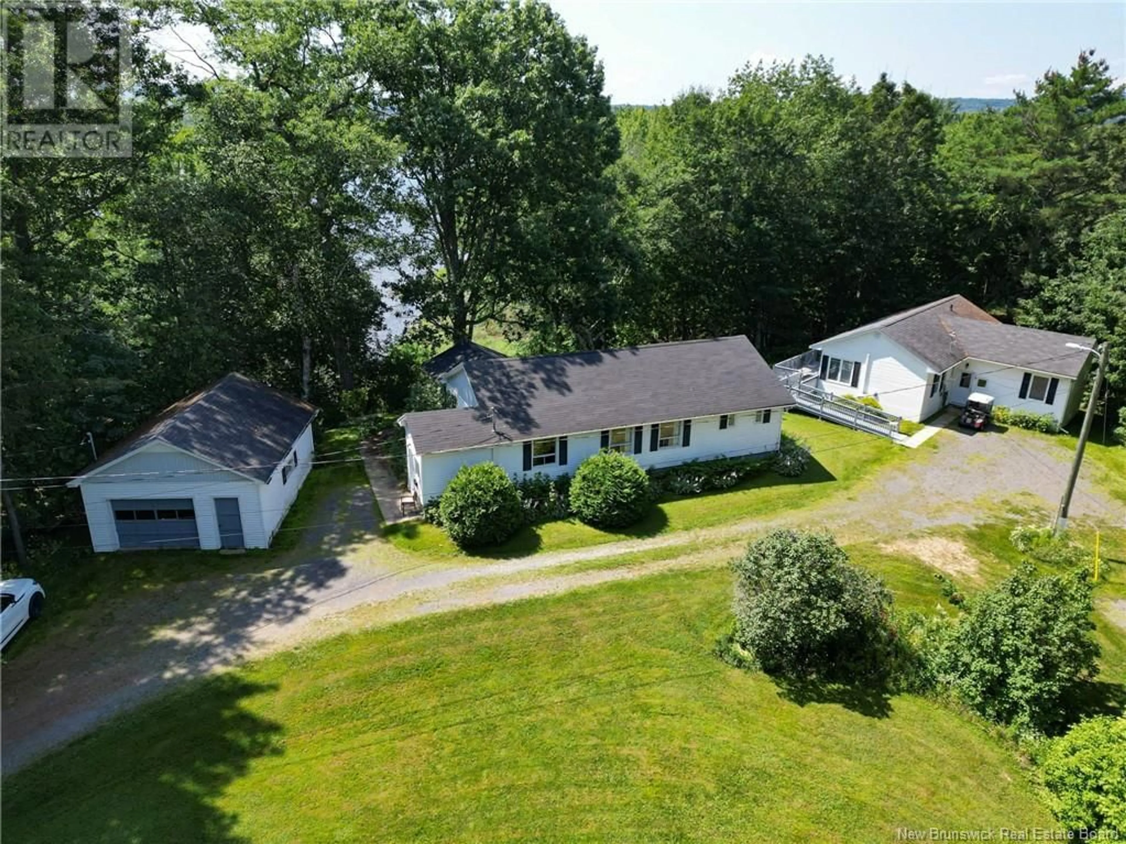 A pic from outside/outdoor area/front of a property/back of a property/a pic from drone, unknown for 20 NICHOLSON LANE, Douglas New Brunswick E3G7M1
