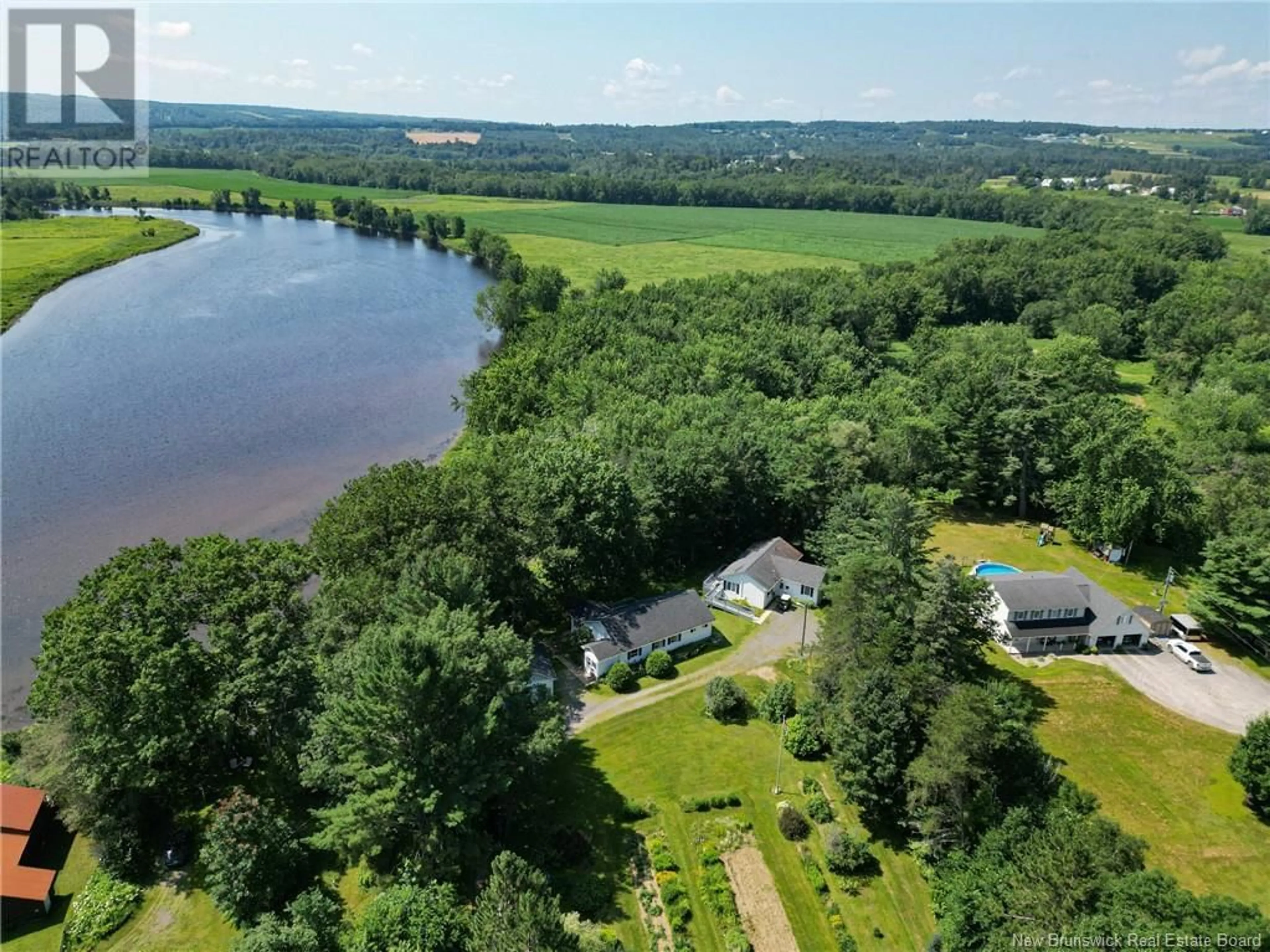 A pic from outside/outdoor area/front of a property/back of a property/a pic from drone, water/lake/river/ocean view for 20 NICHOLSON LANE, Douglas New Brunswick E3G7M1