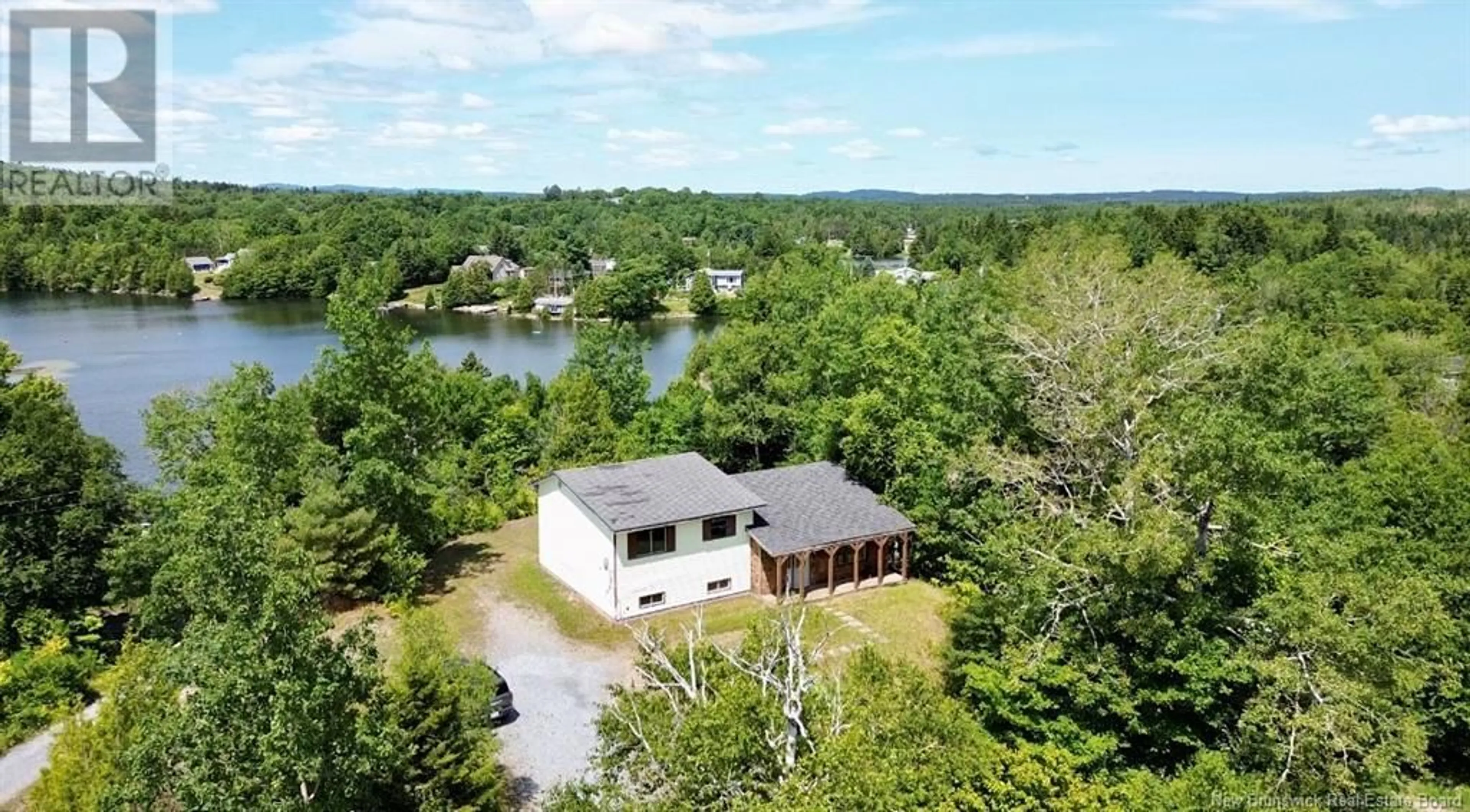 A pic from outside/outdoor area/front of a property/back of a property/a pic from drone, water/lake/river/ocean view for 239 BRADLEY LAKE ROAD, Rothesay New Brunswick E2S1B7