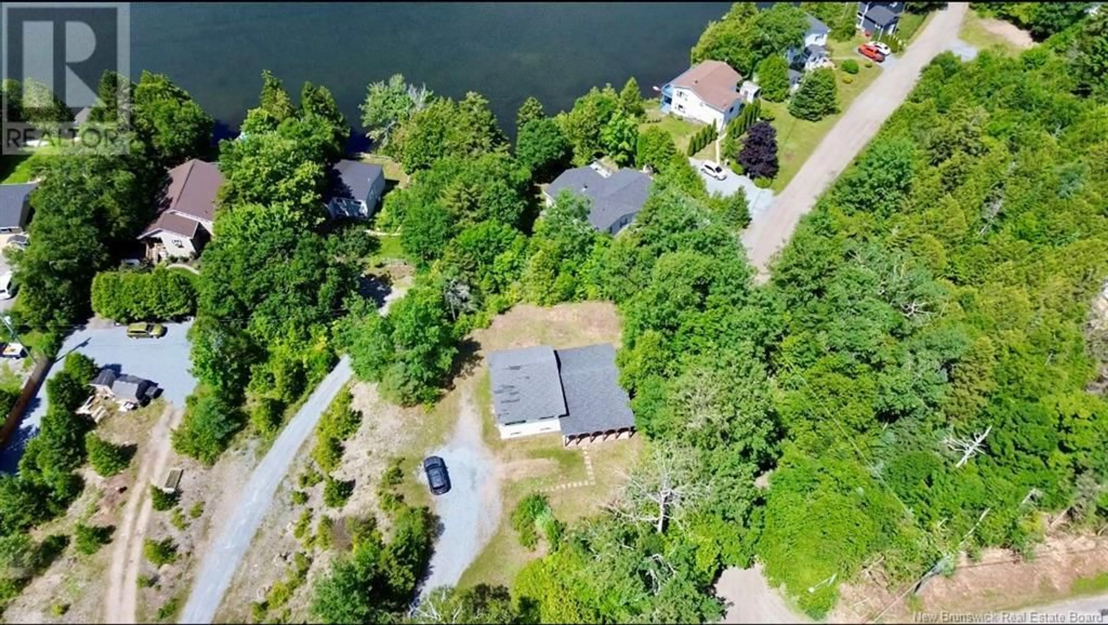 A pic from outside/outdoor area/front of a property/back of a property/a pic from drone, water/lake/river/ocean view for 239 BRADLEY LAKE ROAD, Rothesay New Brunswick E2S1B7