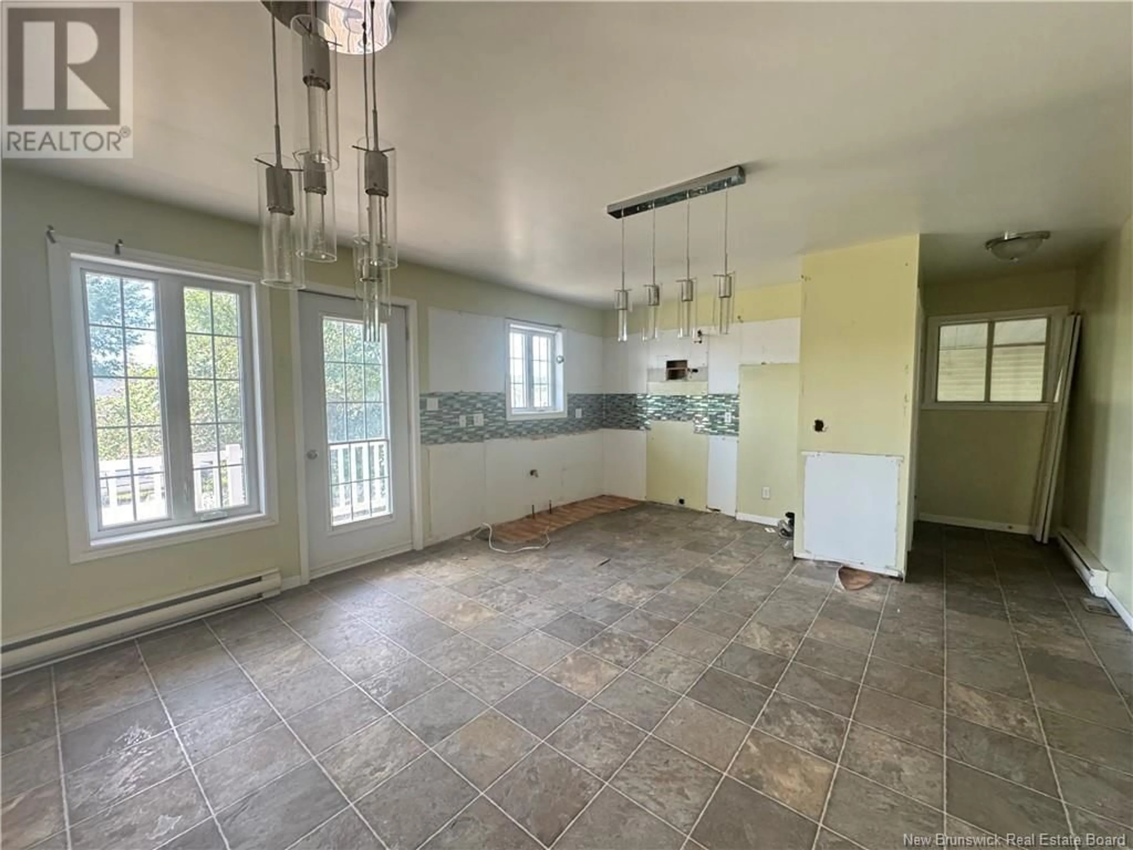 Open concept kitchen, ceramic/tile floor for 10 ST-PAUL STREET, Kedgwick New Brunswick E8B1M9
