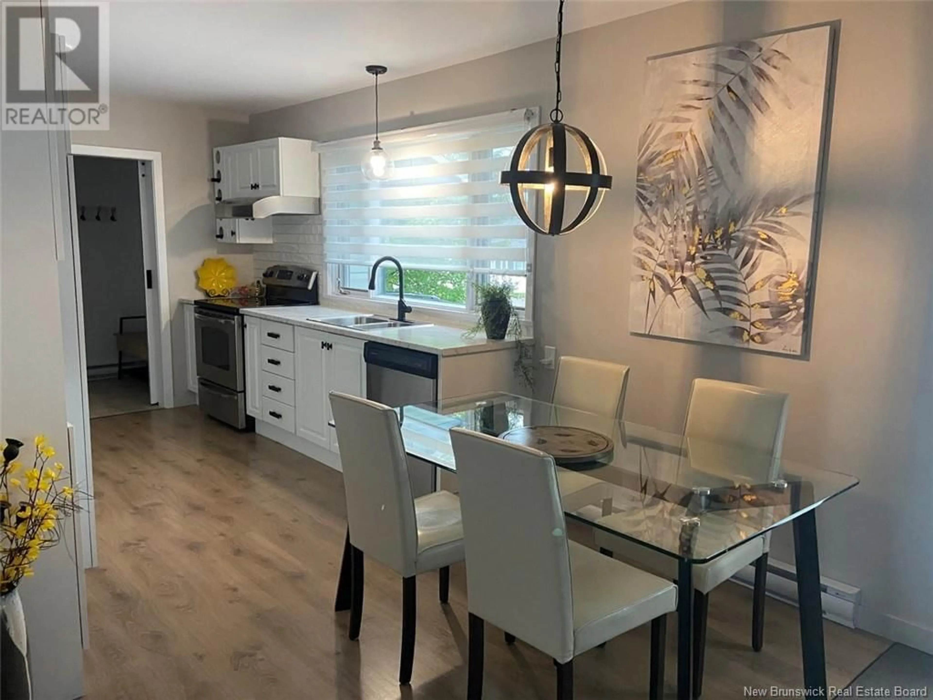 Open concept kitchen, wood/laminate floor for 43 47TH AVENUE, Edmundston New Brunswick E3V3C1