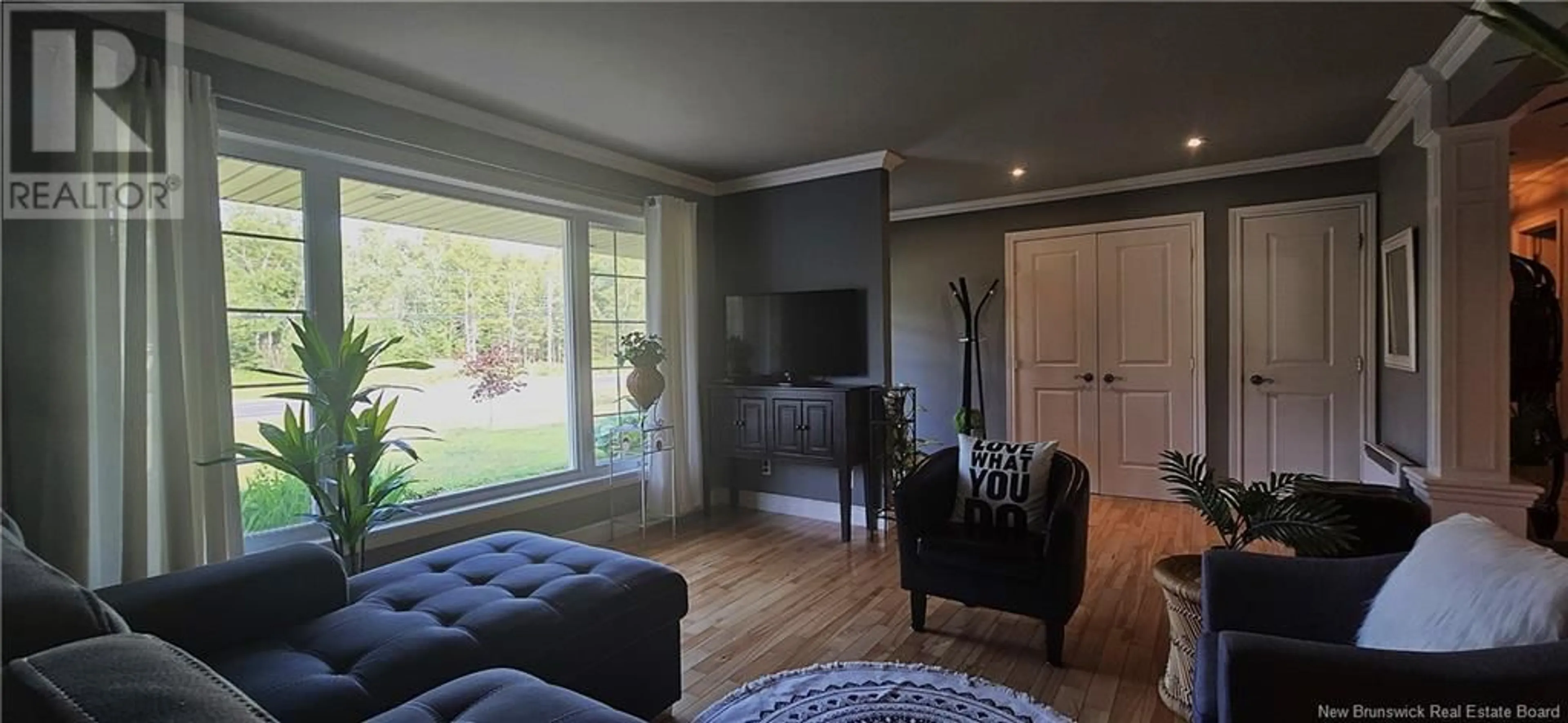 Living room with furniture, wood/laminate floor for 749 RUE ACADIE, Grande-Anse New Brunswick E8N1G3