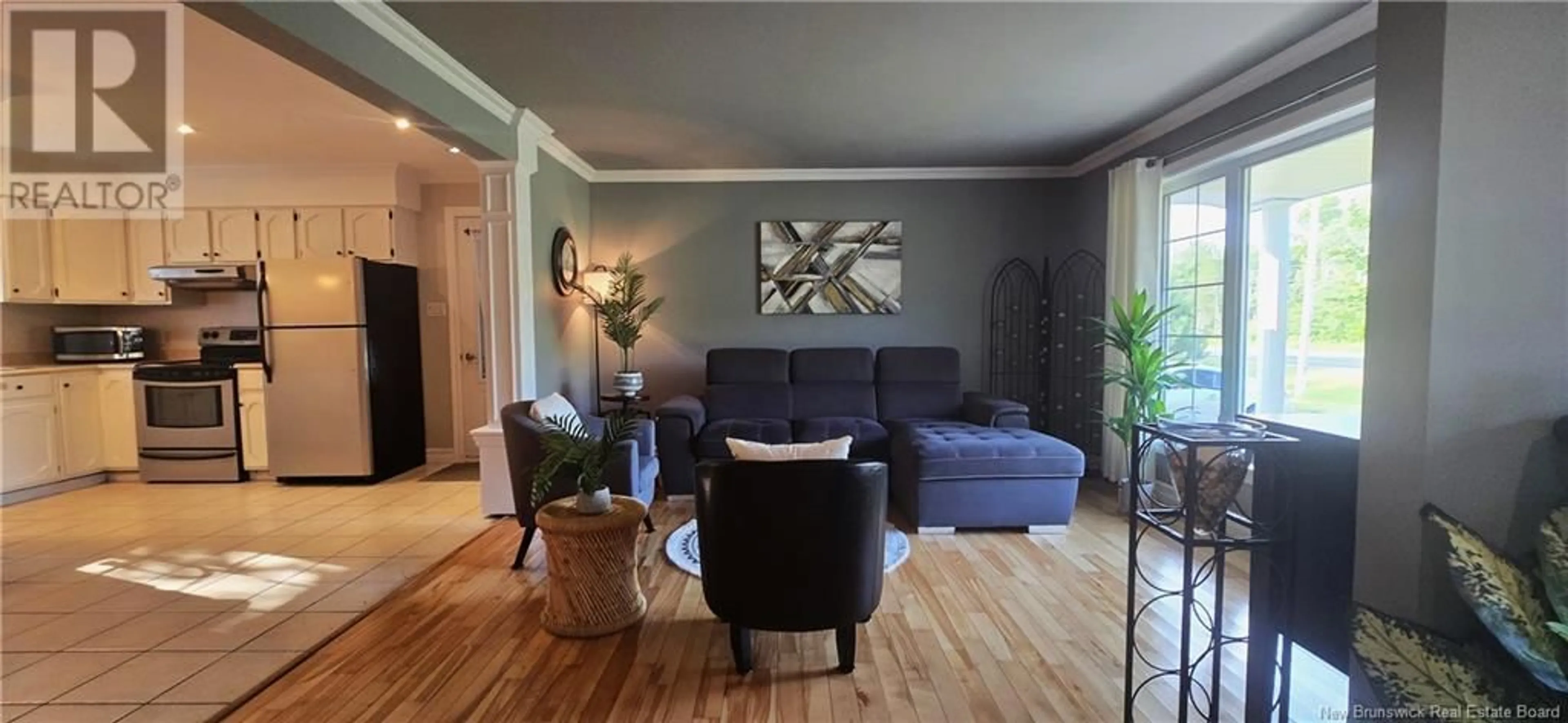 Living room with furniture, wood/laminate floor for 749 RUE ACADIE, Grande-Anse New Brunswick E8N1G3