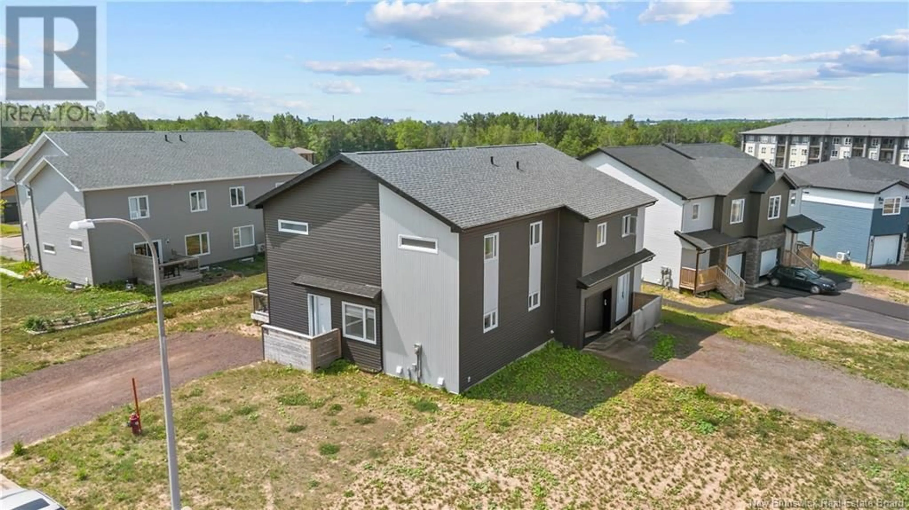 A pic from outside/outdoor area/front of a property/back of a property/a pic from drone, building for 70 GENARATION AVENUE, Moncton New Brunswick E1A9S8