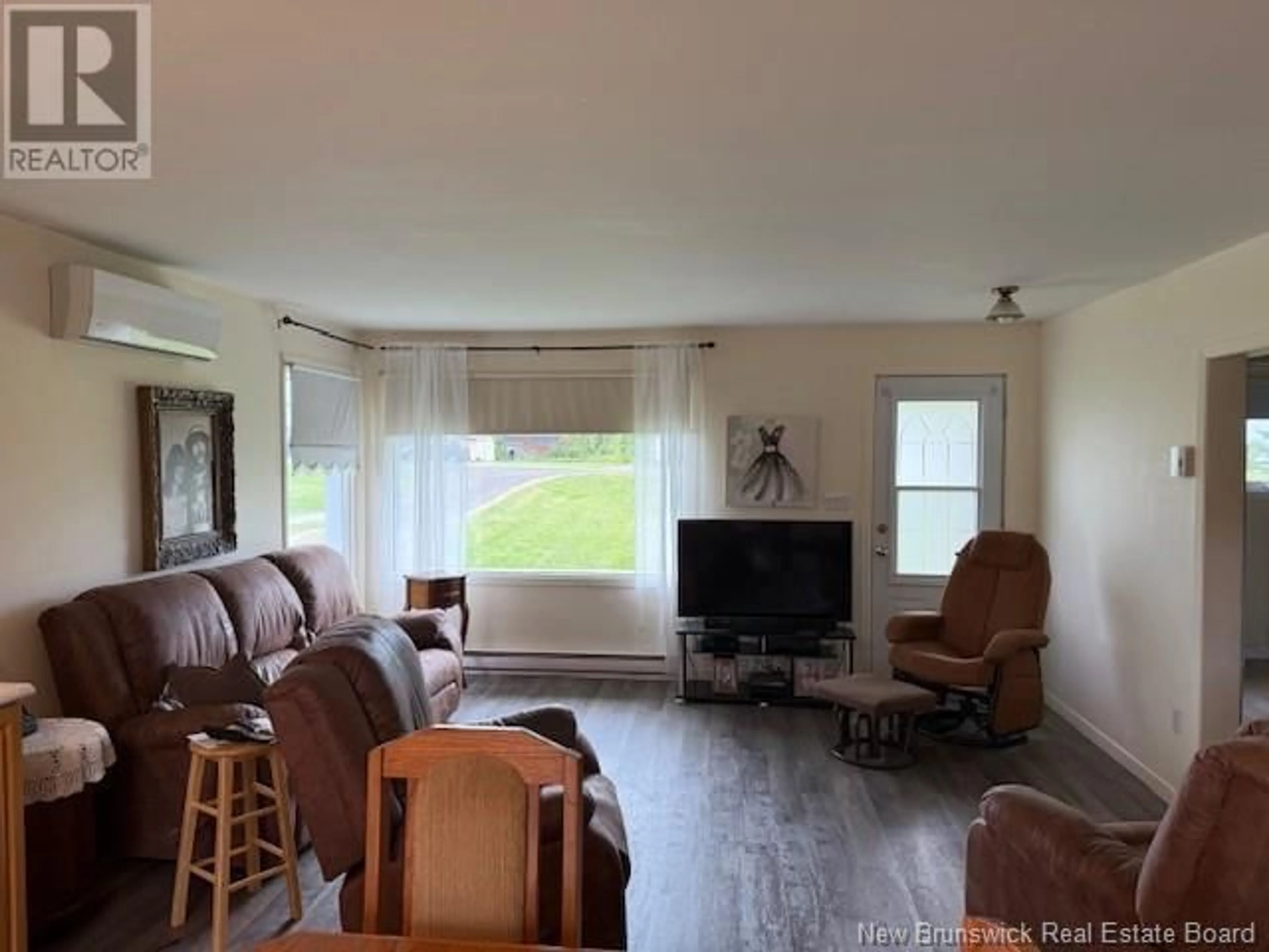 Living room with furniture, wood/laminate floor for 1184 DES PIONNIERS AVENUE, Balmoral New Brunswick E8E2X3