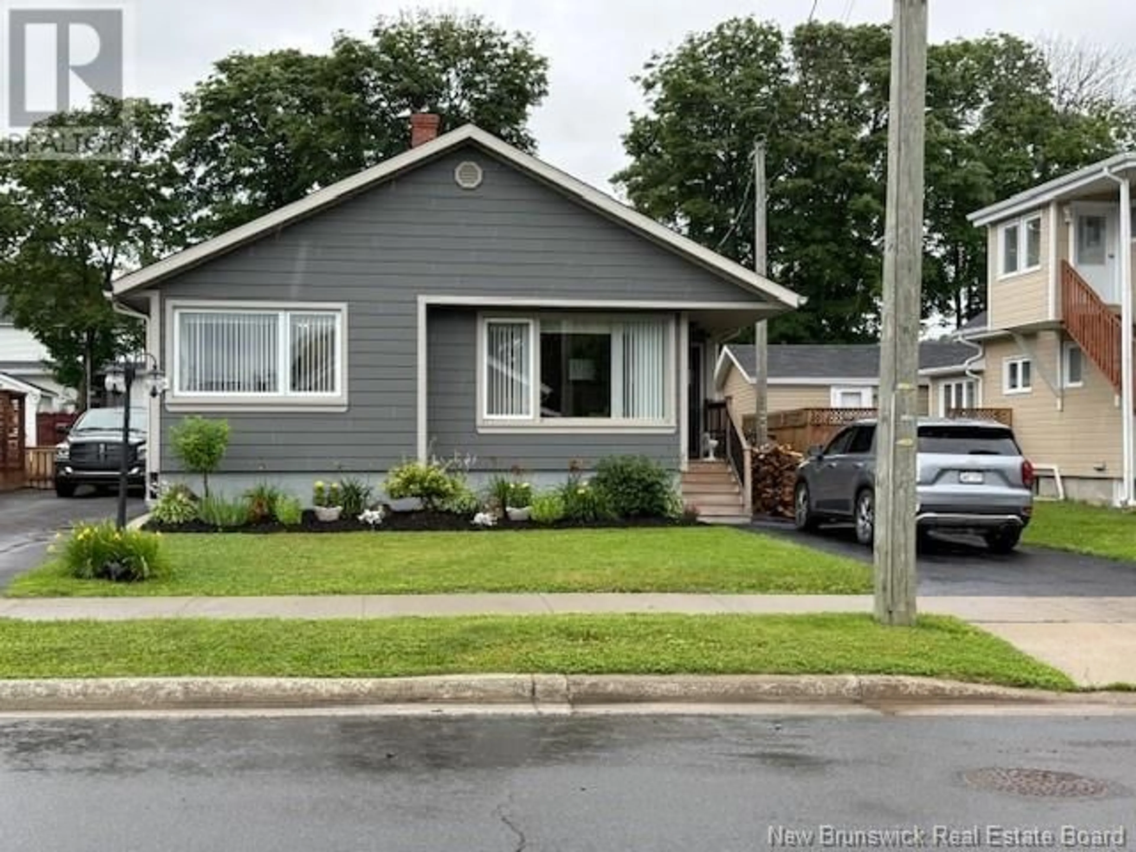 Home with vinyl exterior material, street for 48 VICTORIA STREET, Campbellton New Brunswick E3N1H9