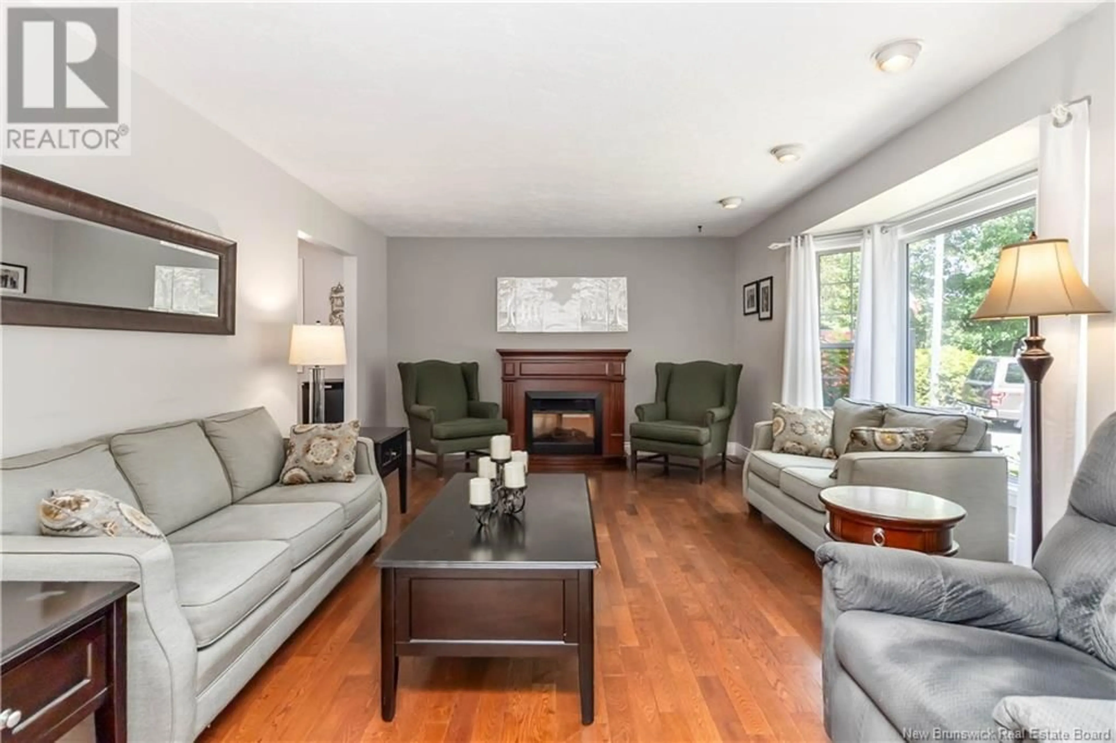 Living room with furniture, wood/laminate floor for 1550 RYAN STREET, Moncton New Brunswick E1G2V3