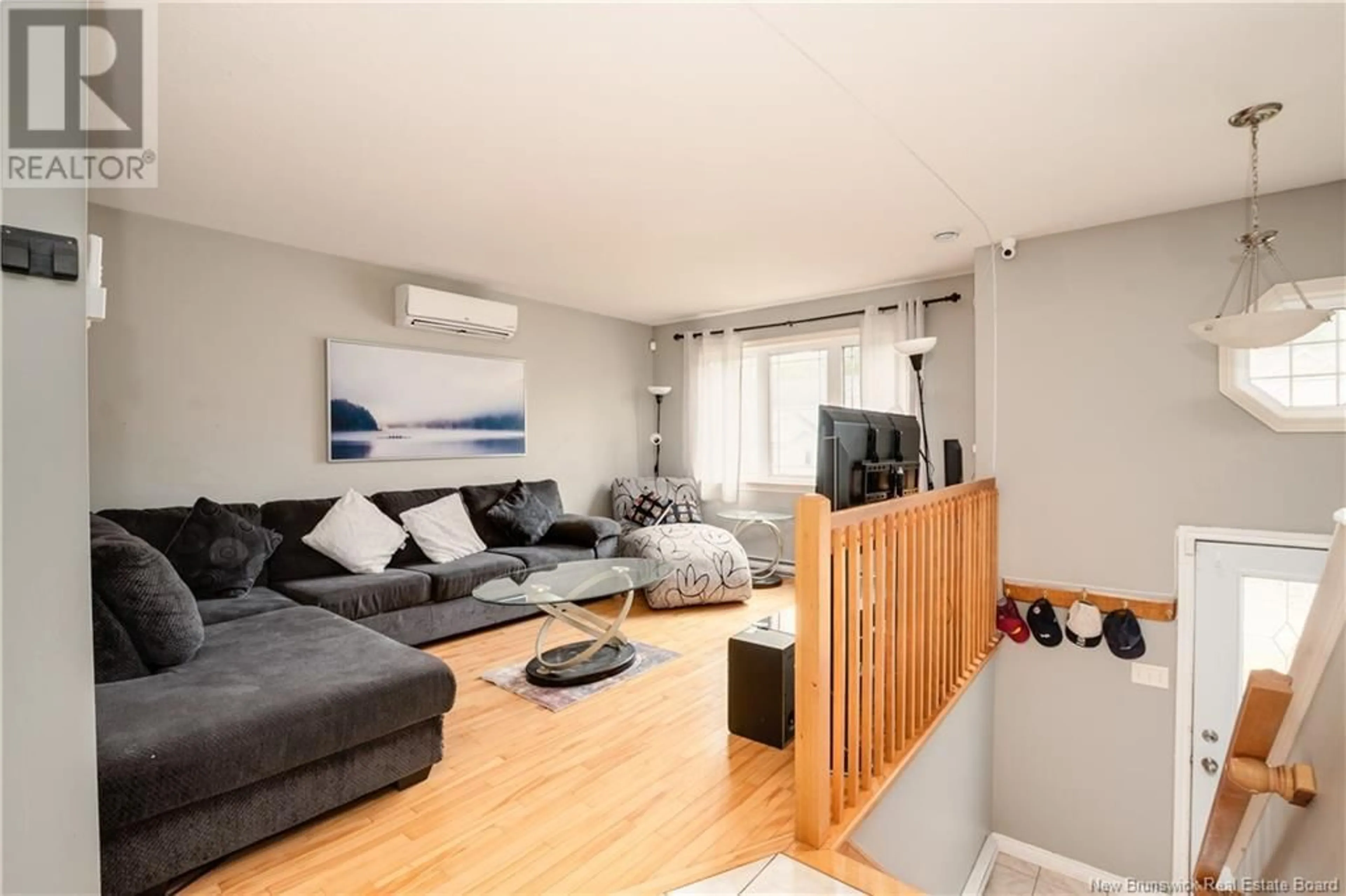 Living room with furniture, wood/laminate floor for 233 LONSDALE STREET, Moncton New Brunswick E1G0A9
